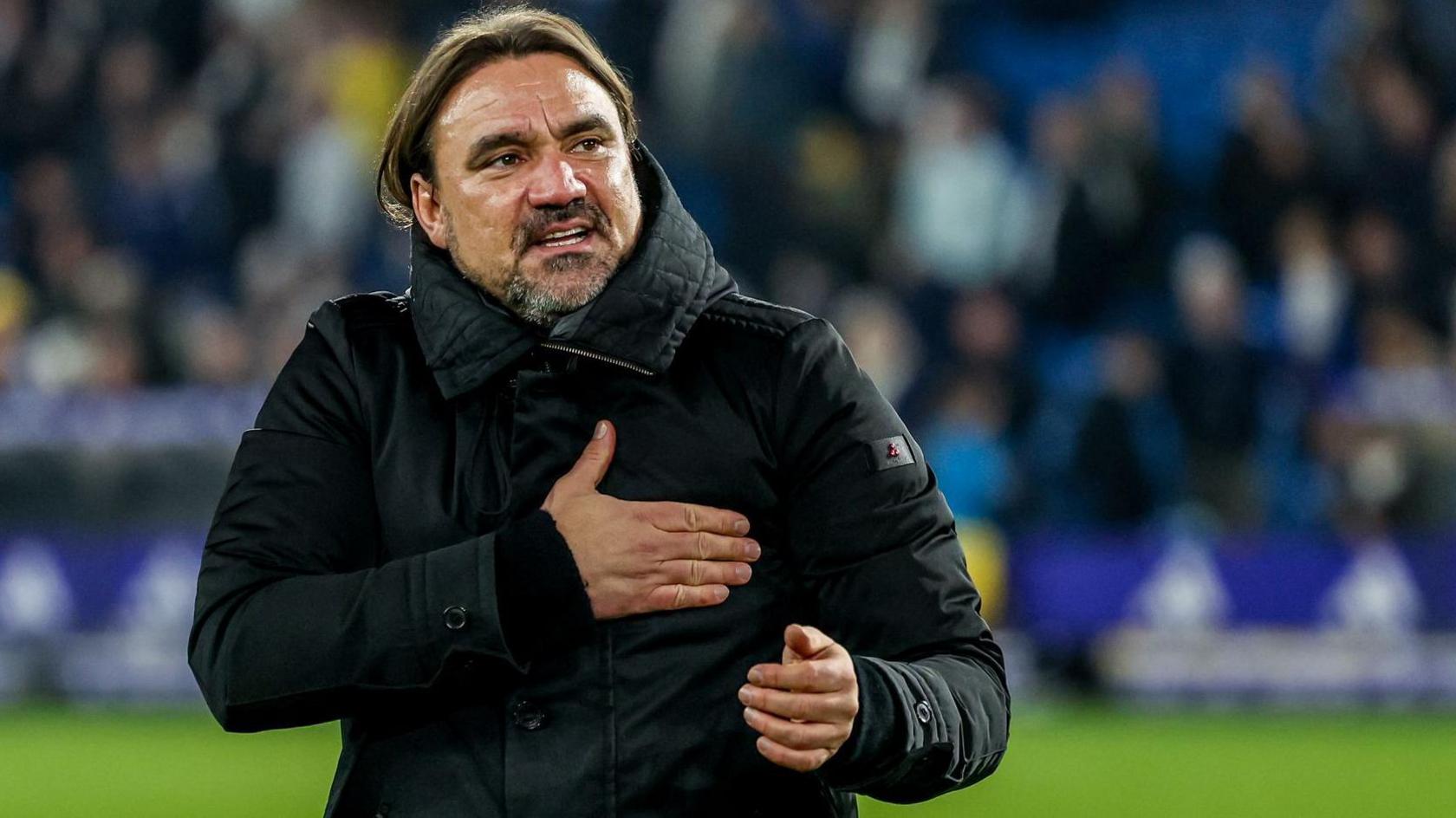 Daniel Farke pats his heart to Leeds fans