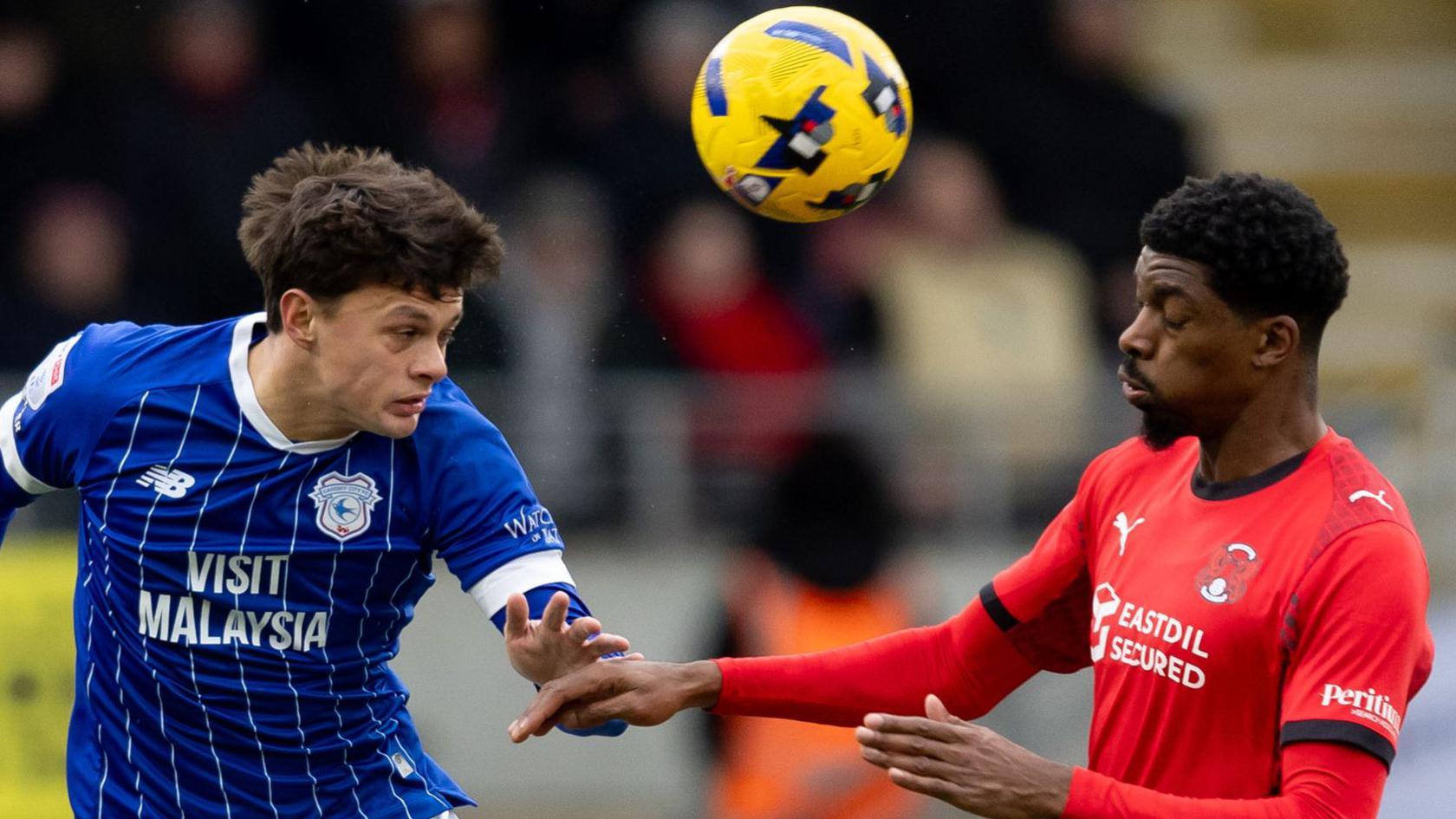 Perry Ng of Cardiff City and Tyreeq Bakinson onf Leyton Orient