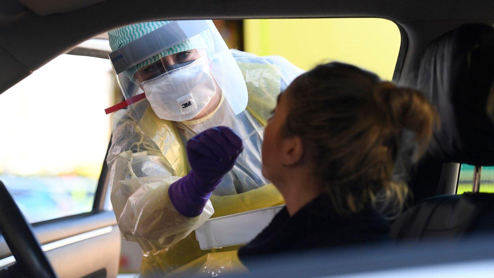 An emergency department nurse during a demonstration of the coronavirus pod and covid-19 virus testing procedures set-up at Antrim Area Hospital in Northern Ireland.