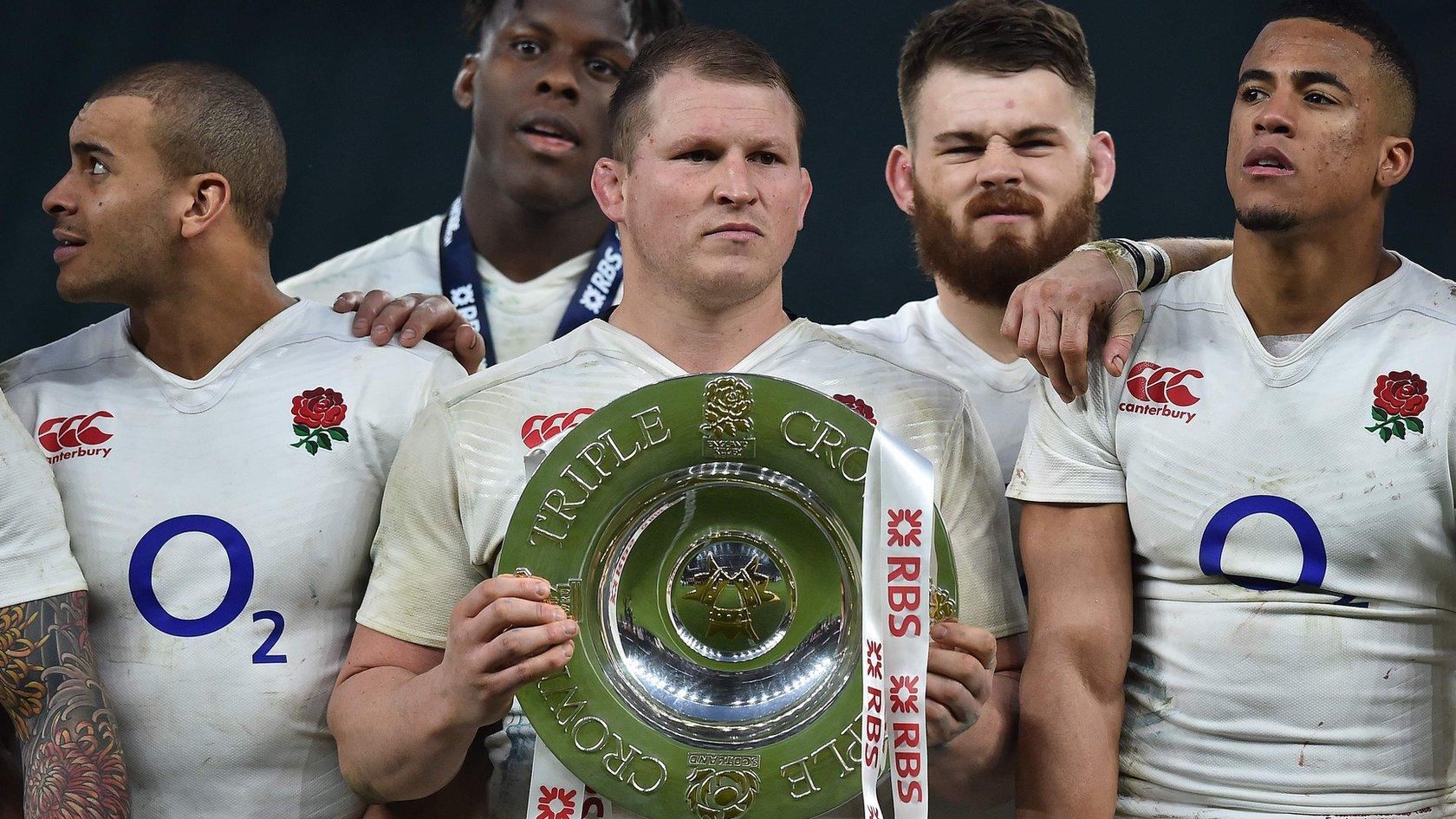 Dylan Hartley holds the Triple Crown trophy