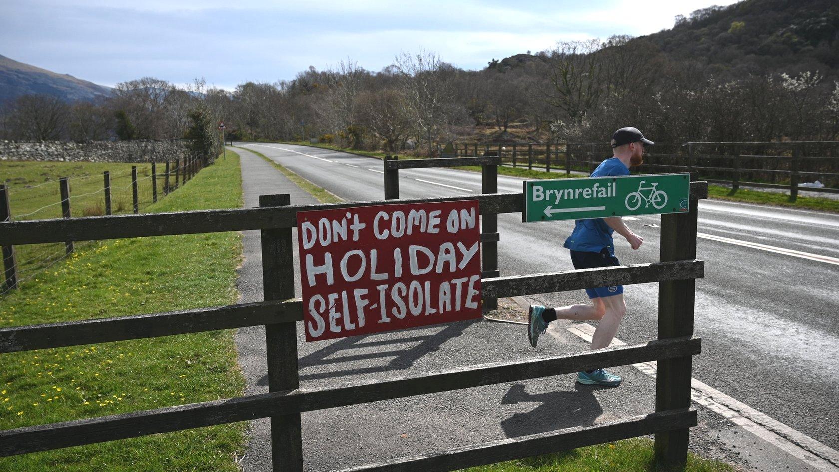 Road in north Wales with sign warning vistors not to come