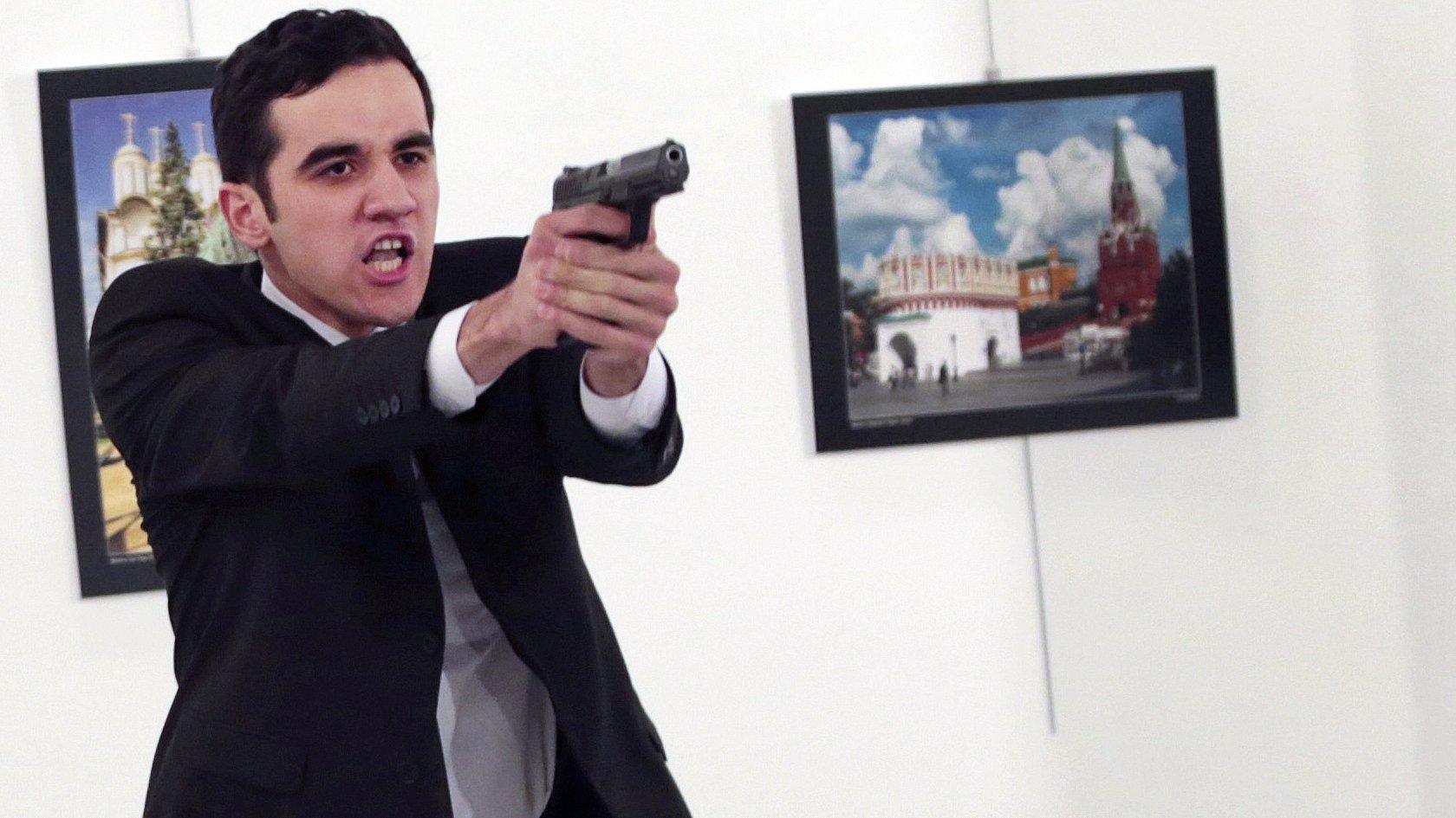 An unnamed gunman gestures after shooting the Russian Ambassador to Turkey, Andrei Karlov, at a photo gallery in Ankara