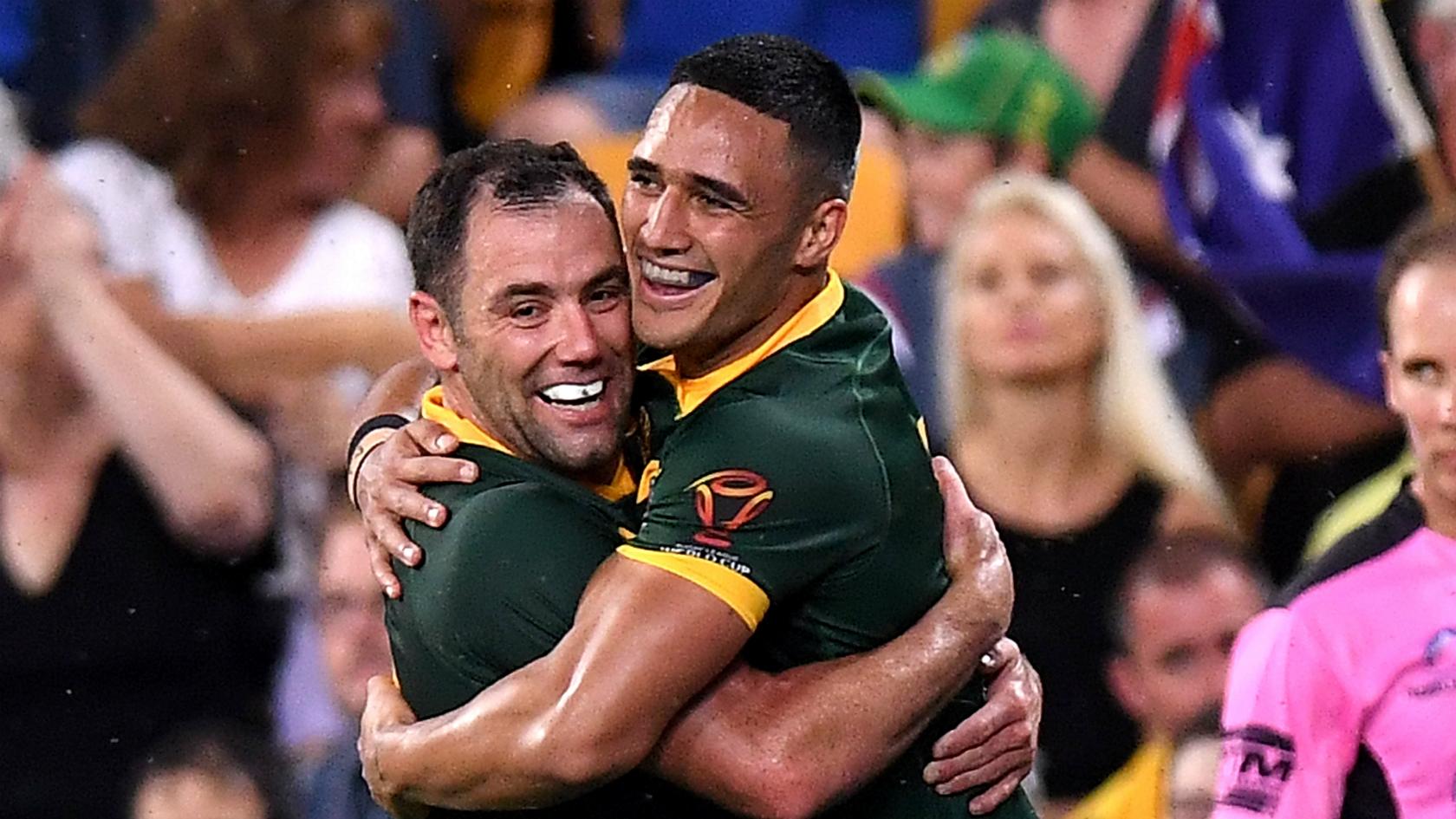 Valentine Holmes (right) celebrates scoring with skipper Cameron Smith