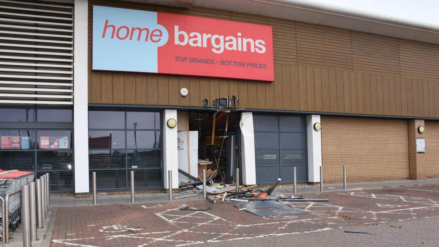 Debris at the front of a Home Bargains shop after it was rammed into.