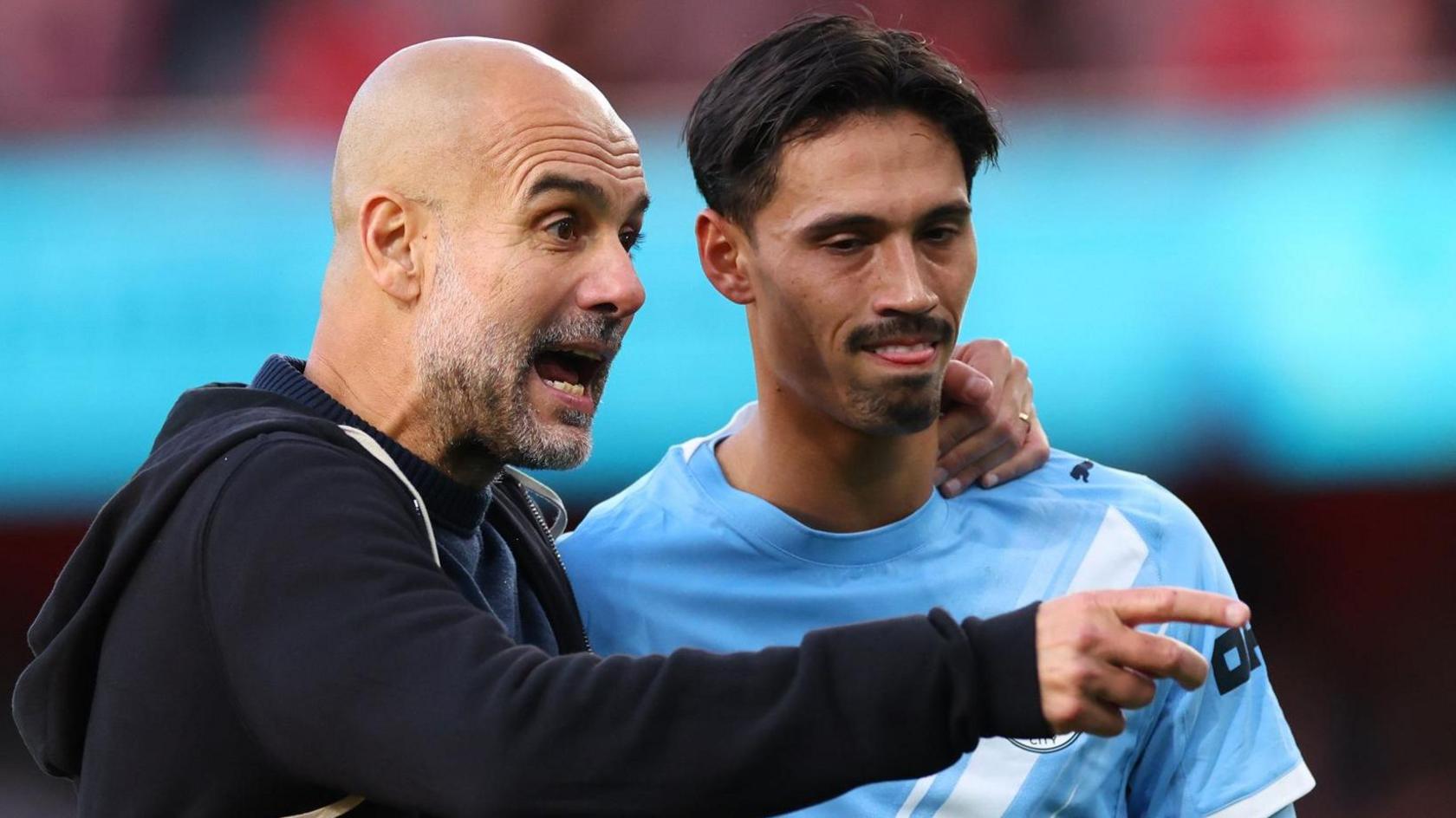 Pep Guardiola and Tijjani Reijnders
