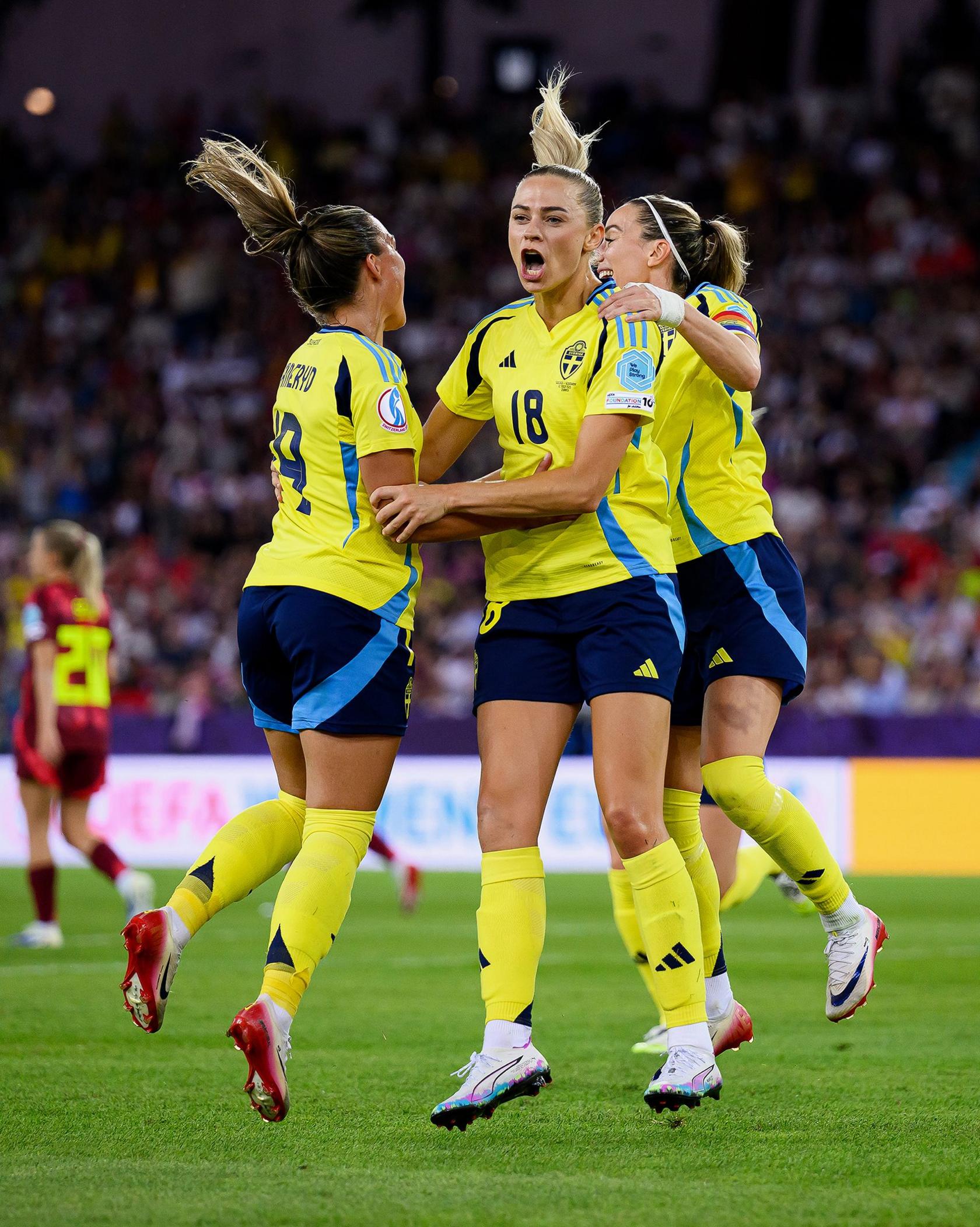 Sweden's Fridolina Rolfo celebrates scoring her team's third goal from the penalty spot with team mates Kosovare Asllani and Johanna Rytting Kaneryd during the Group C match against Germany. Photo by Matthias Hangst