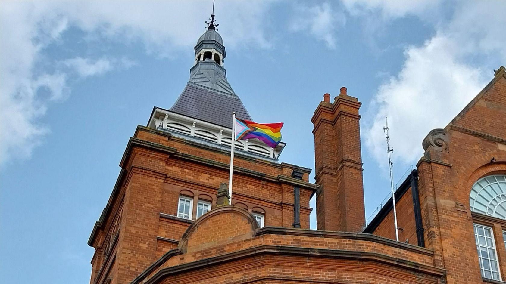 A flag flying on a council building