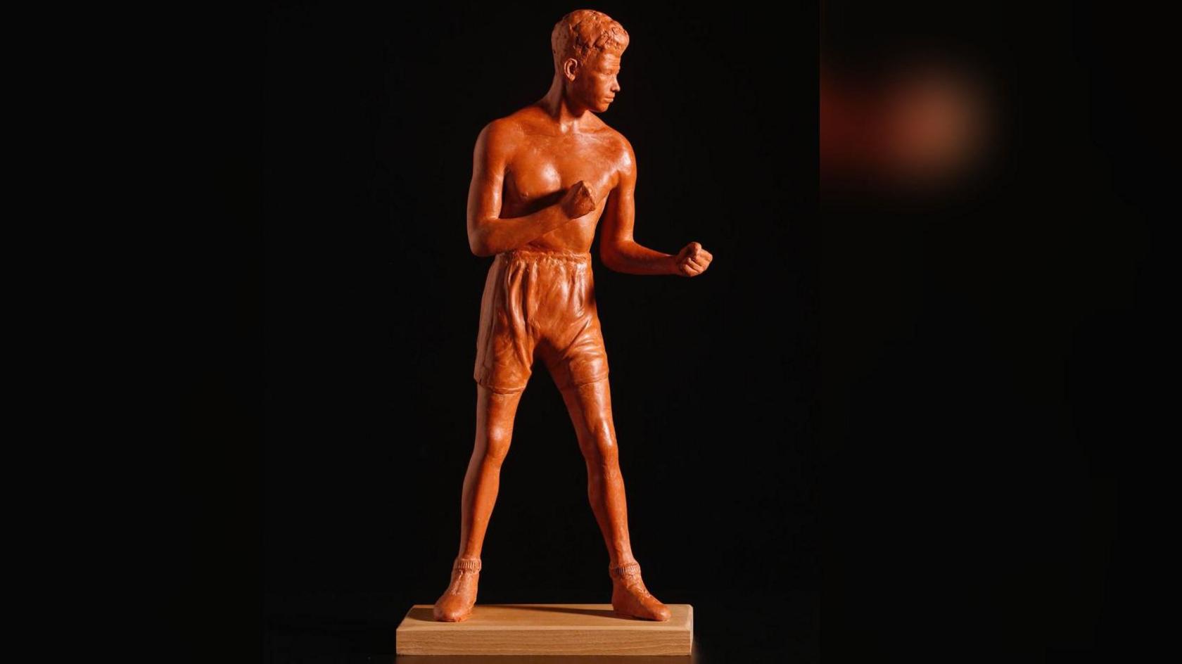 A model of the proposed statue of Len Johnson shows him in boxing shorts and shoes in a sparring stance.