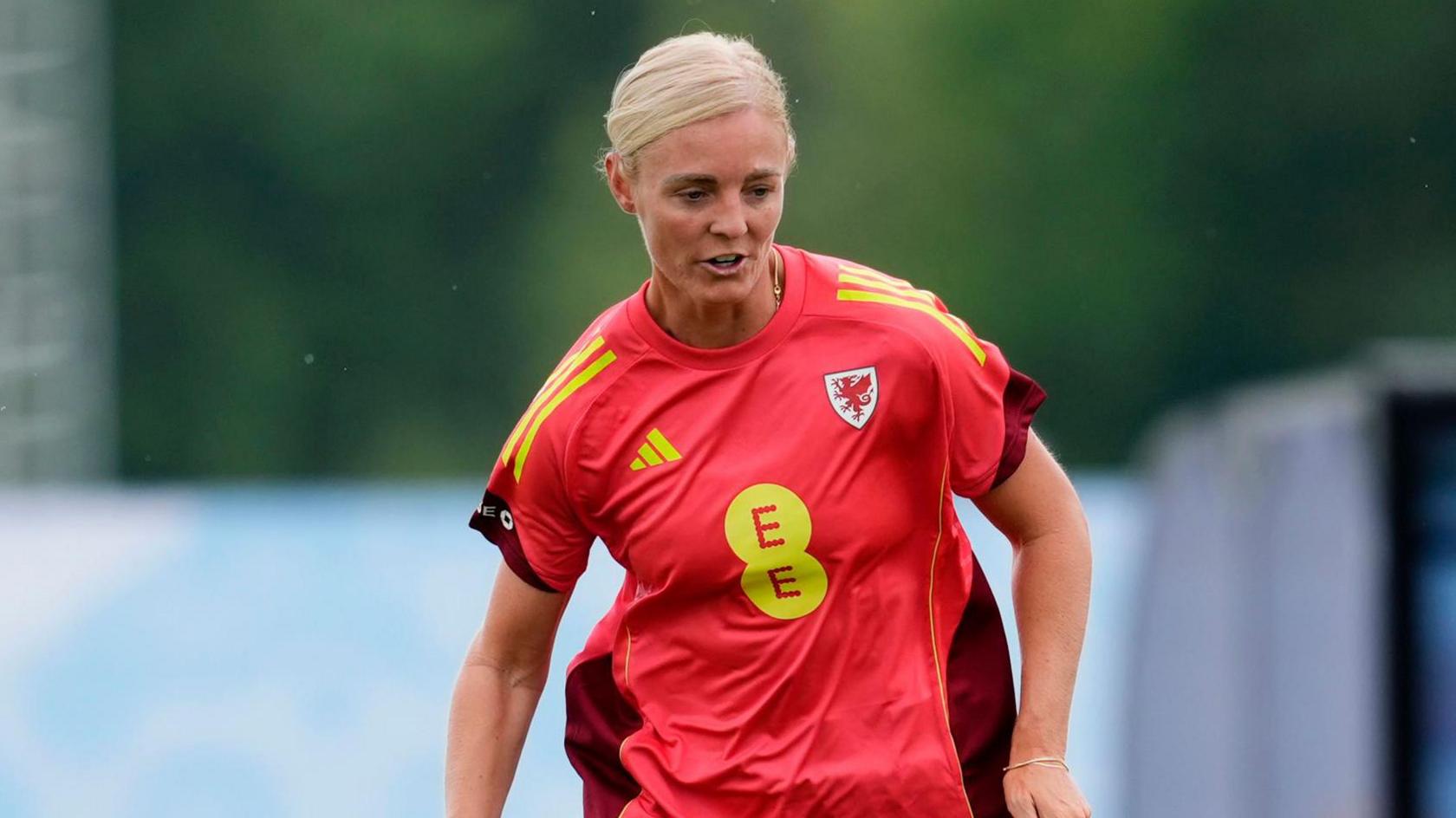 Sophie Ingle runs with the ball during a training session for Wales