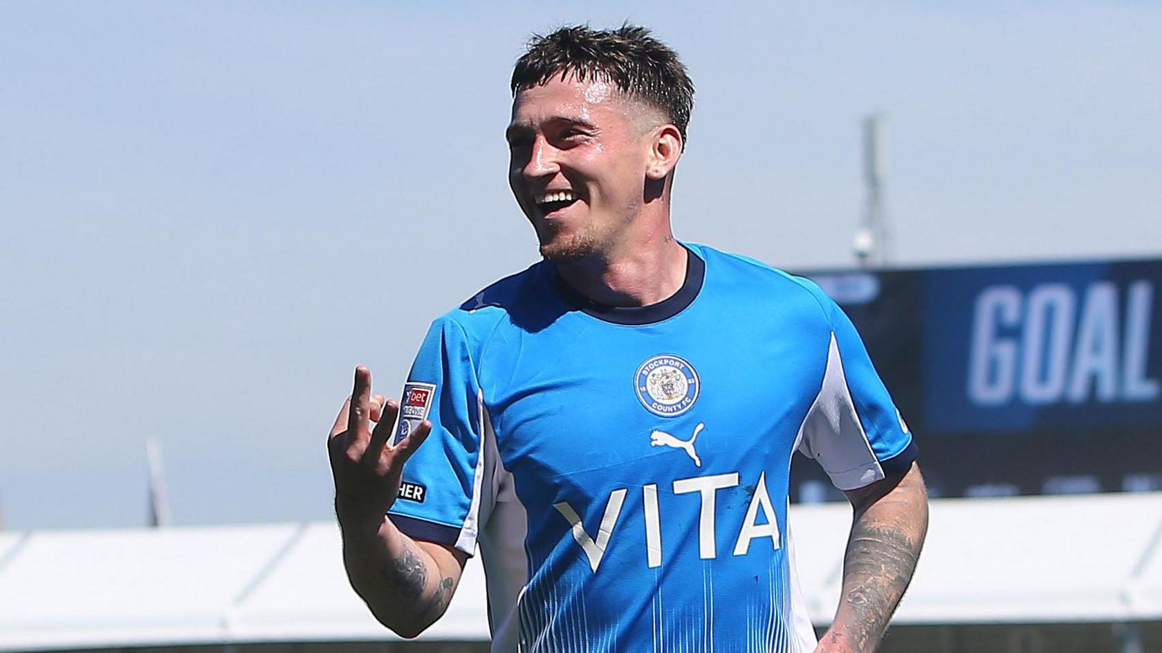 Louie Barry celebrates
