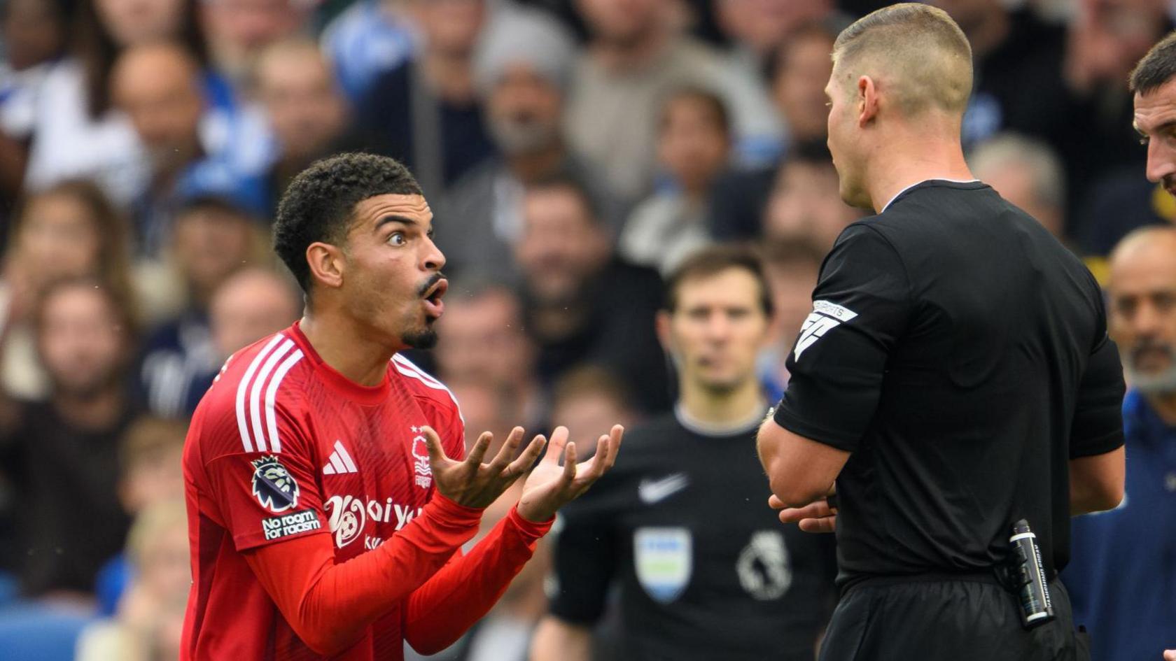 Morgan Gibbs-White protests after being sent off against Brighton