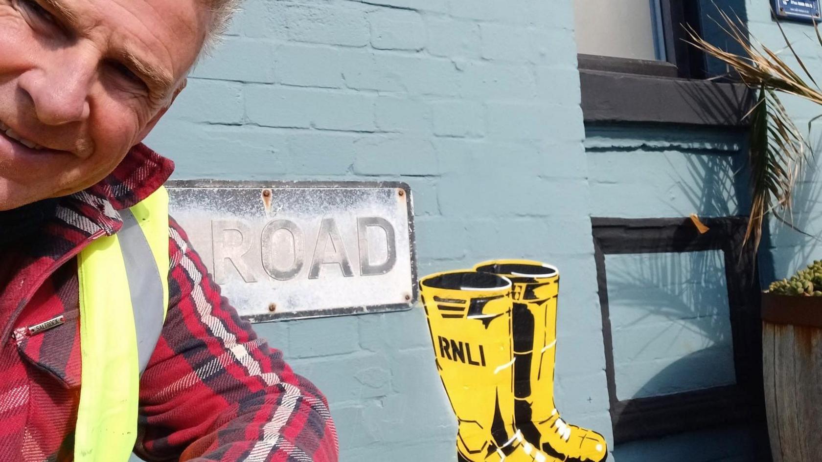 Gary 'Garf' Cook with one of the Exmouth RNLI wellington murals