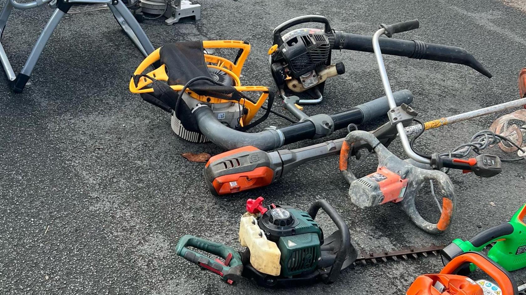 A few of the recovered stolen power tools laid on the ground.