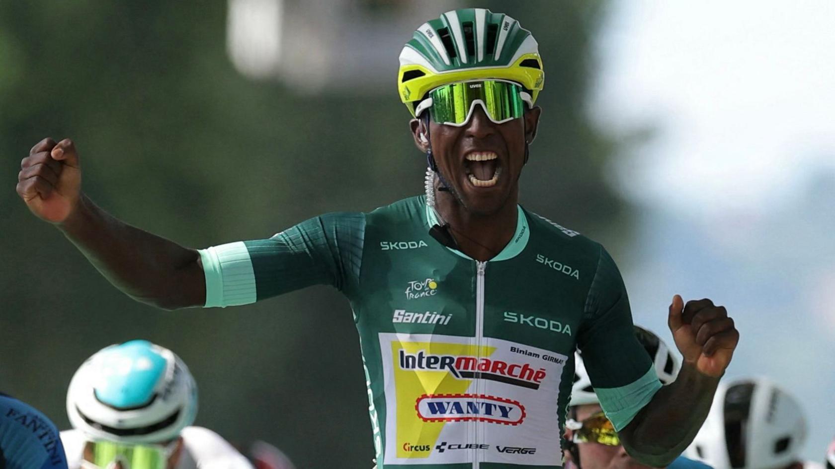 Eritrean rider Biniam Girmay celebrates after winning the 12th stage of the 111th edition of the Tour de France.