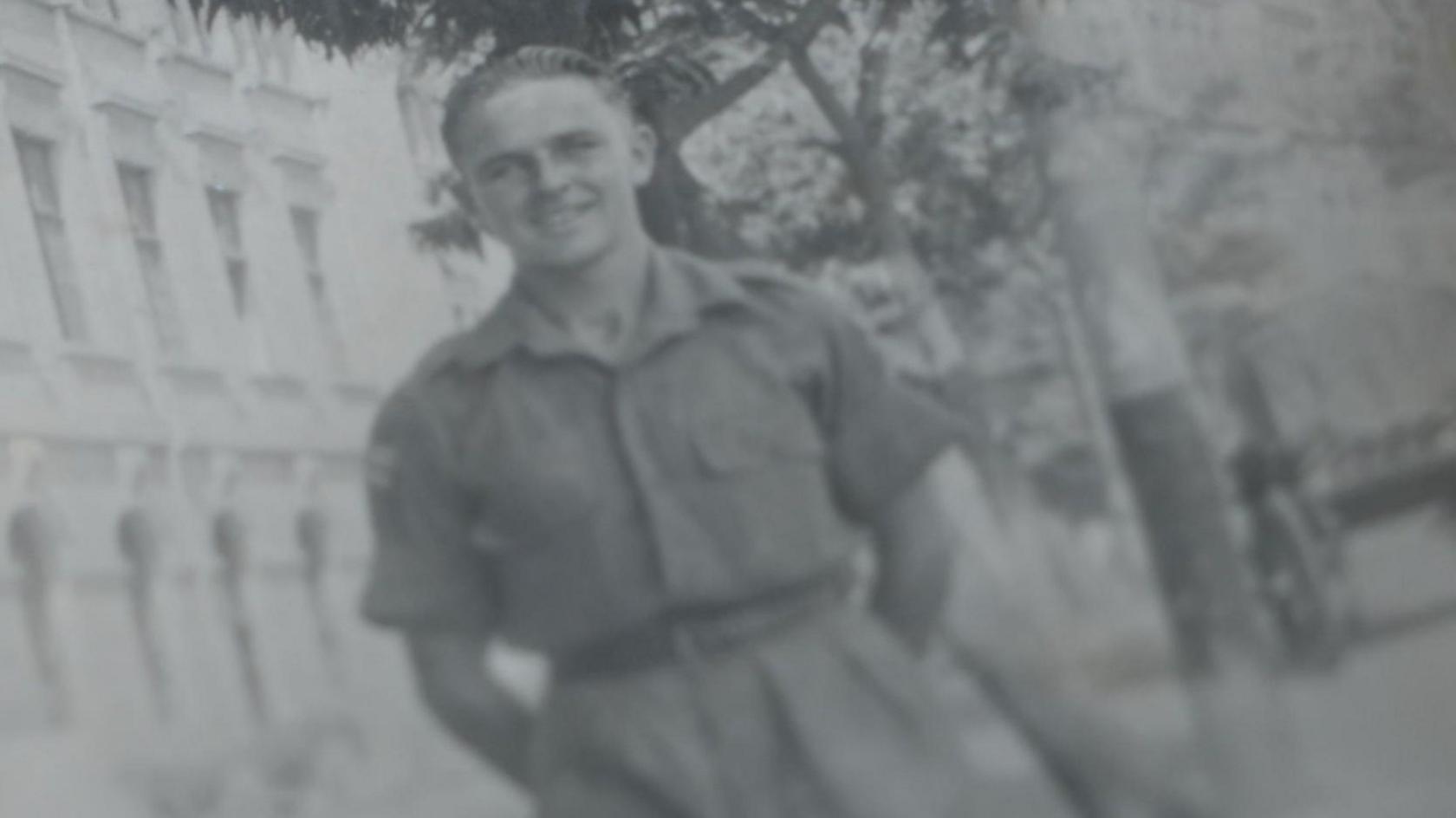 A black and white photograph of a 19-year-old Duncan Hilling in his military uniform in India.