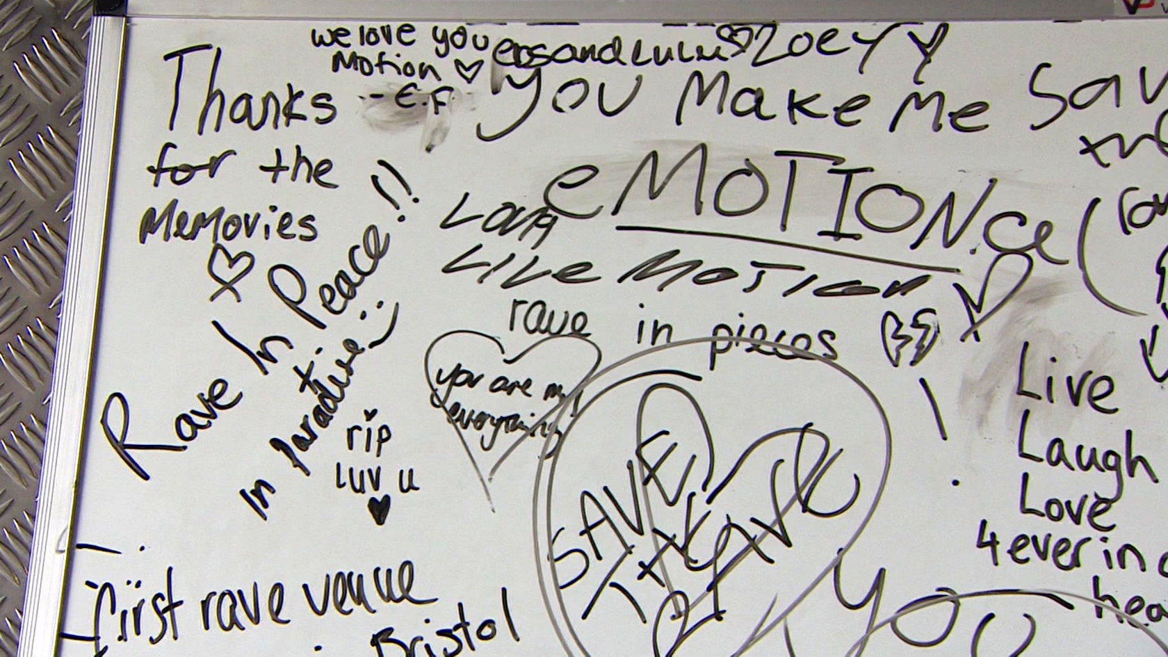 A whiteboard with messages written in black pen, such as 'Save the Rave', 'RIP luv u' and 'Rave in Peace in Paradise'