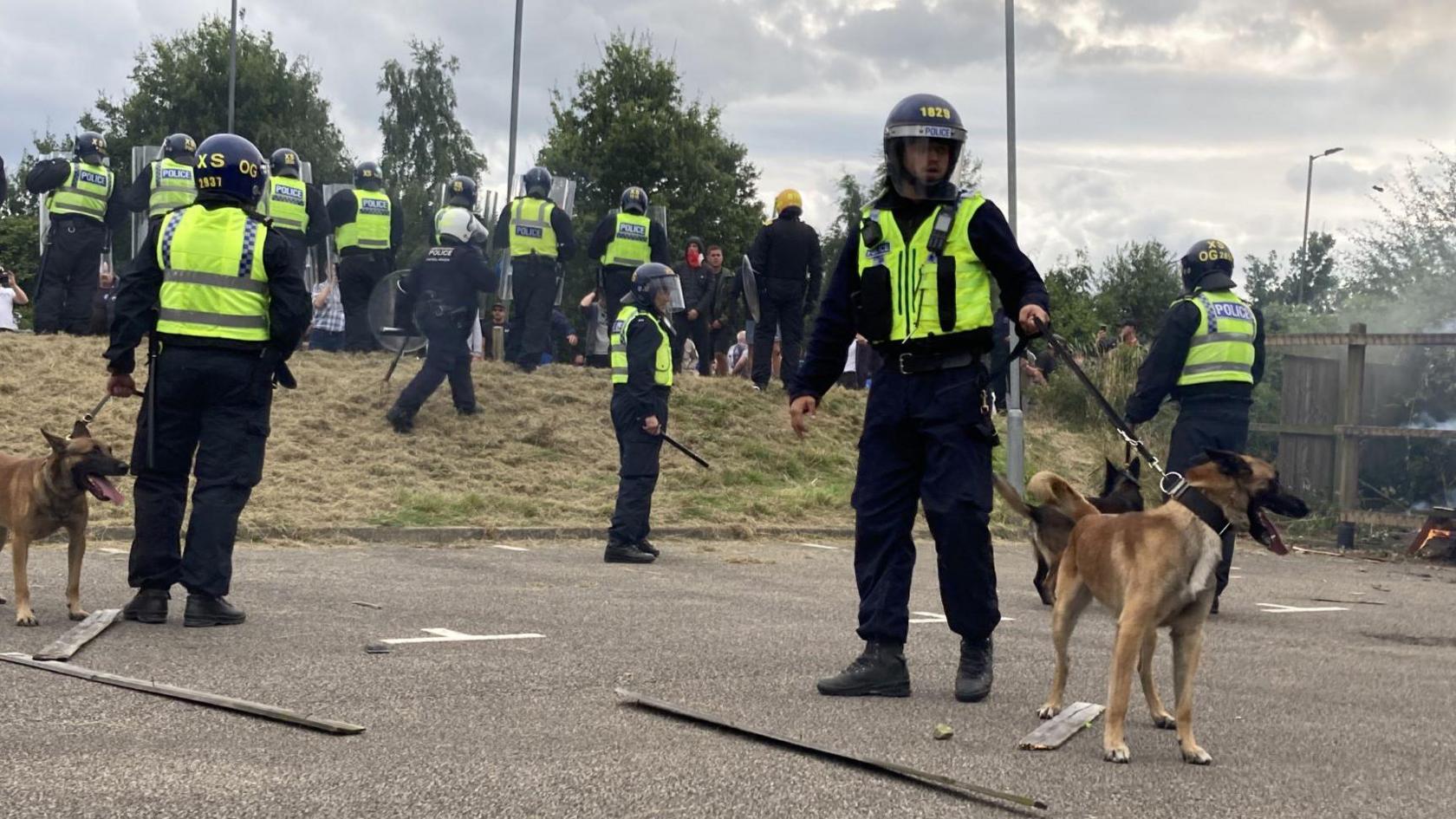 A police dog and police officers