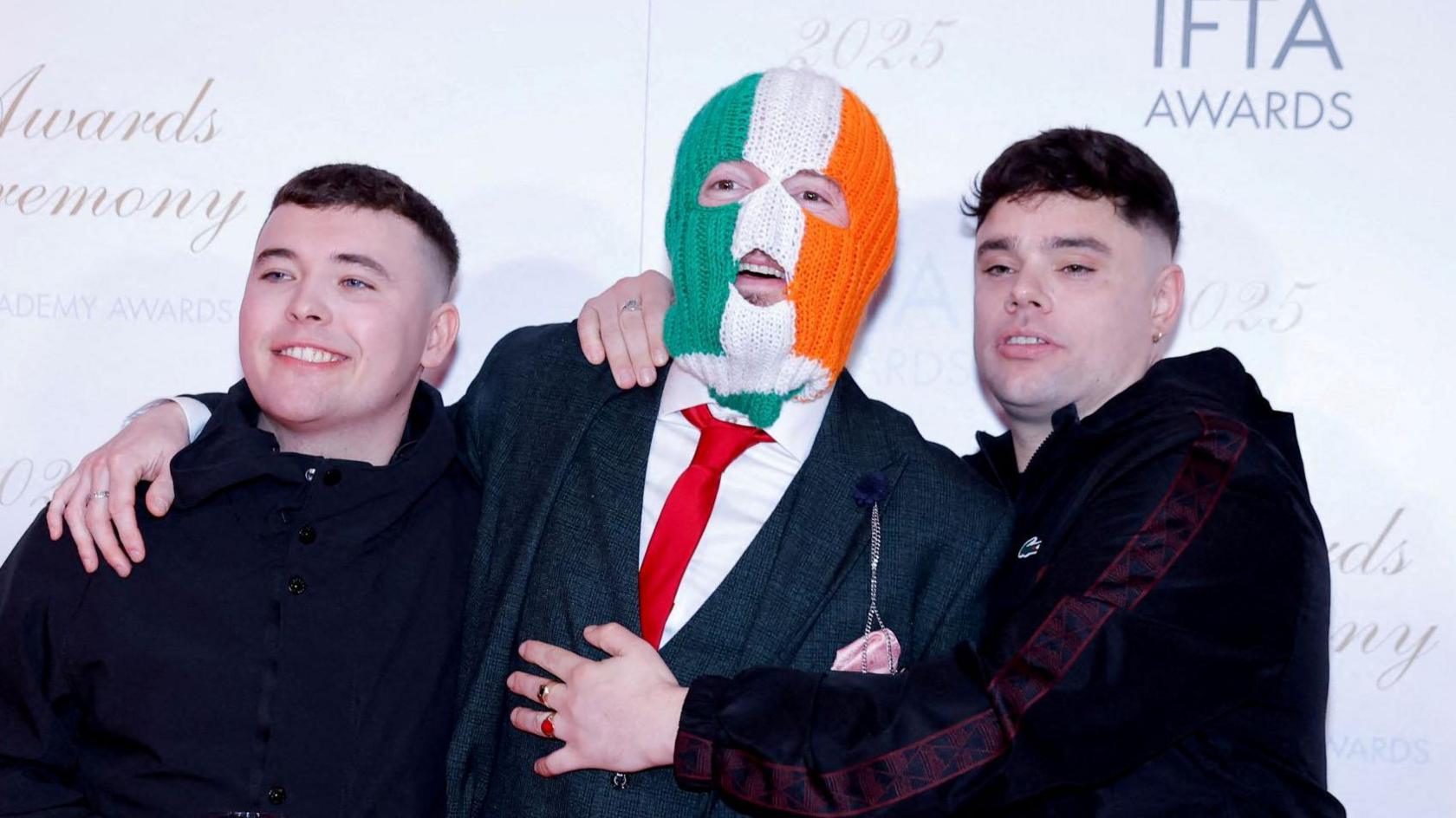 Kneecap members Liam Og O Hannaigh (Mo Chara), JJ O'Dochartaigh (DJ Provai), and Naoise O Caireallain (Moglai Bap) attending the IFTA's. 
