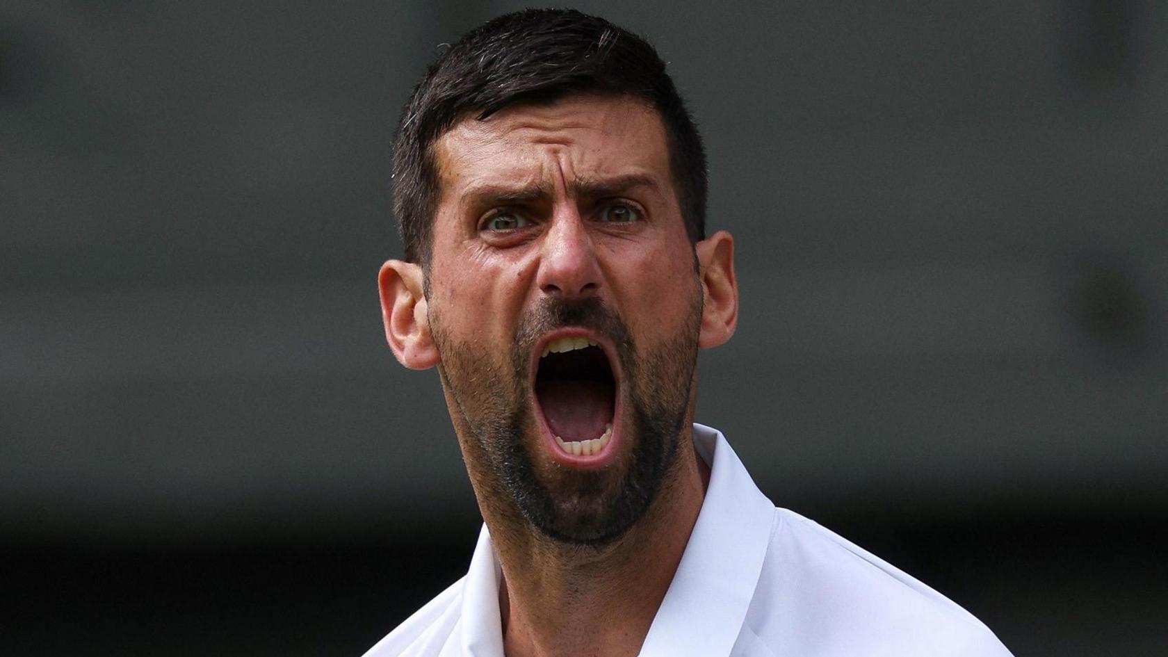 Novak Djokovic celebrates winning a point against Alex de Minaur