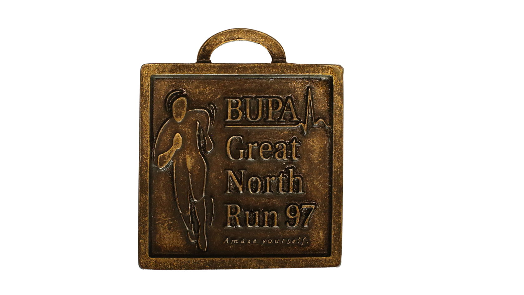 A square bronzed coloured medal that has a silhouette shaped person running. It reads 'Bupa Great North Run 97.