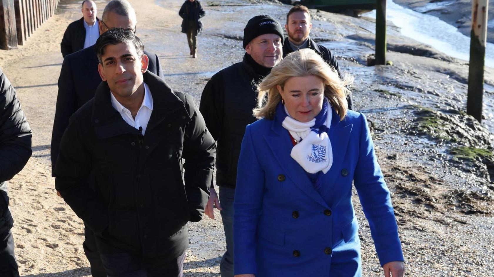 Anna Firth and Rishi Sunak walking along Leigh seafront