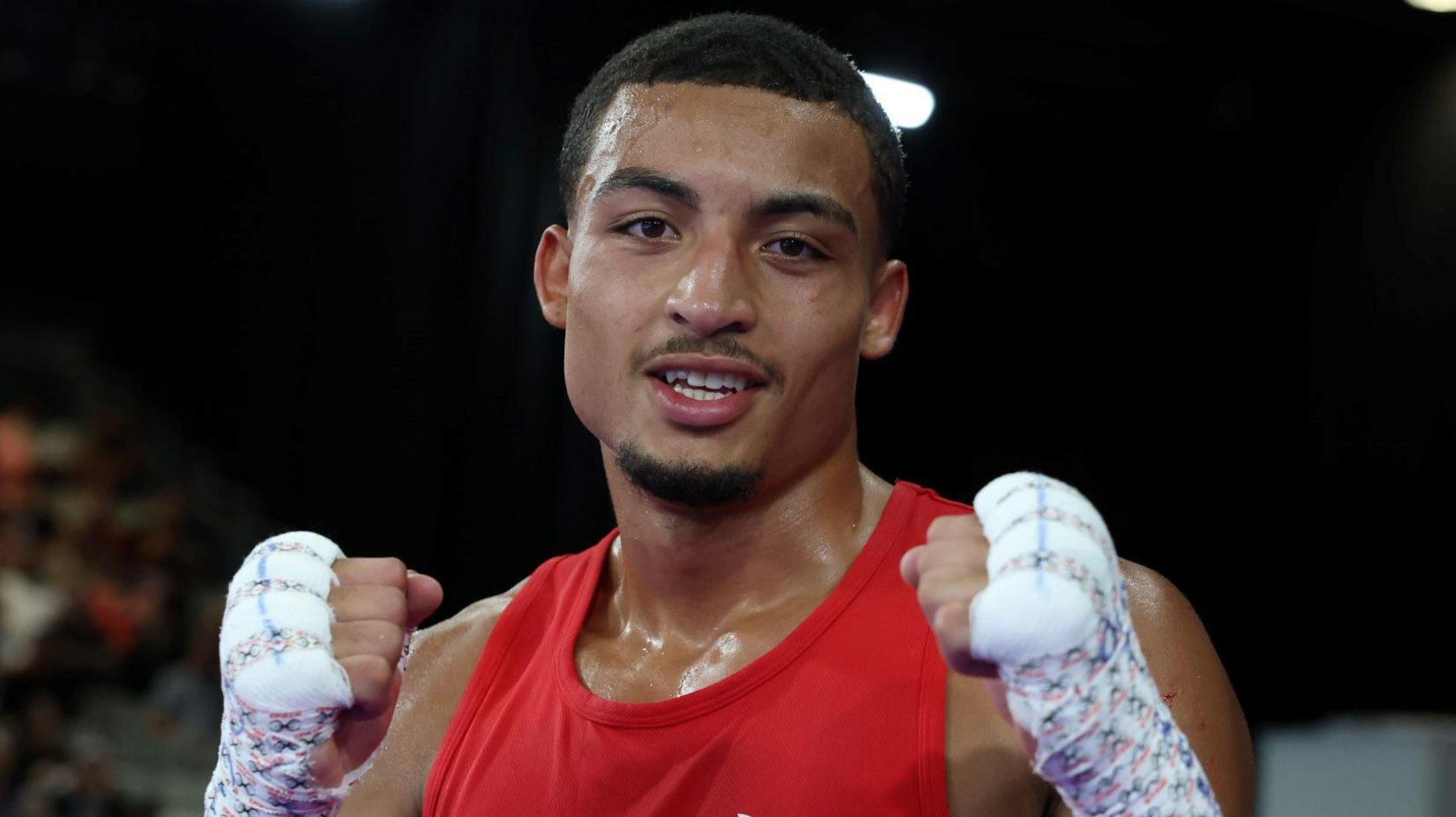 Orlando Holley-Sotomi posing with his fists up