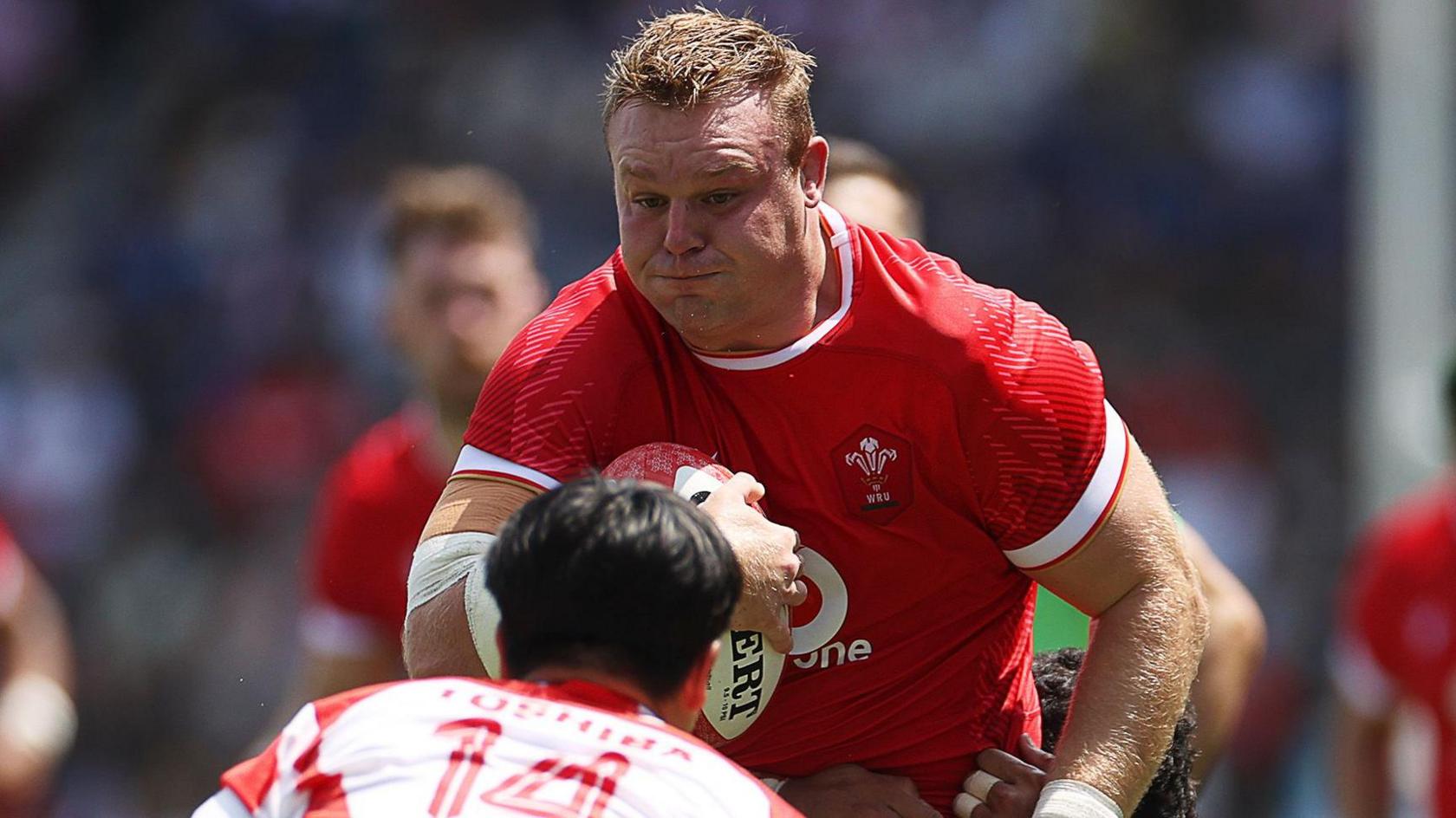 Wales captain Dewi Lake with ball in had on the charge against Japan
