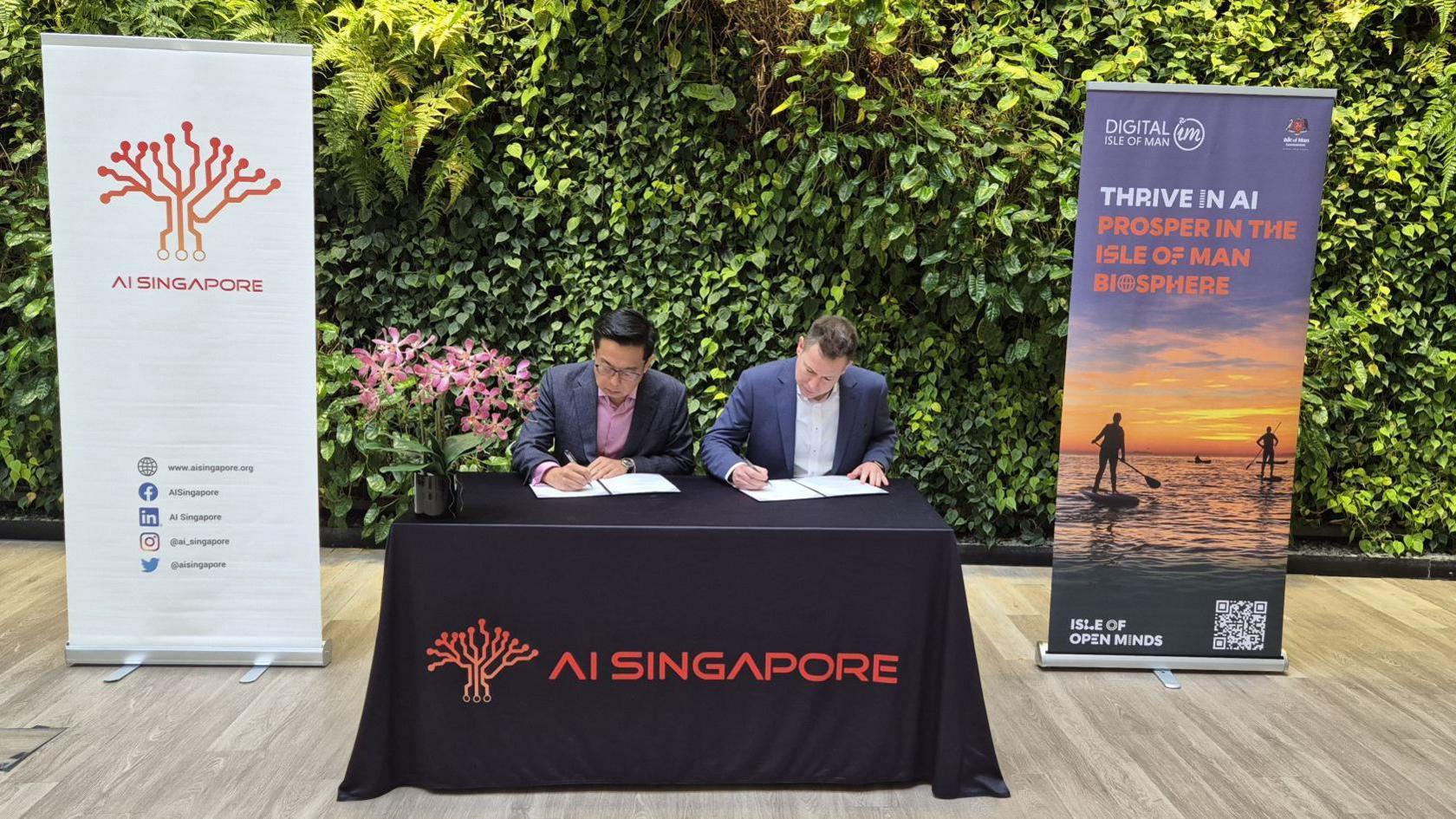 Memorandum of understanding being signed by Laurence Liew and Lyle Wraxall