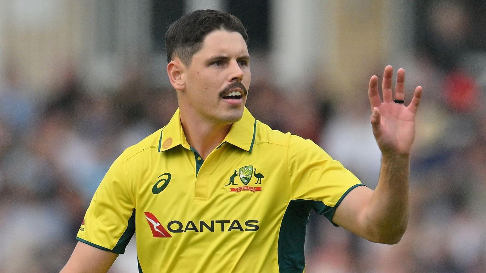 Ben Dwarshuis prepares to catch the ball thrown to him during a game for Australia against England last summer