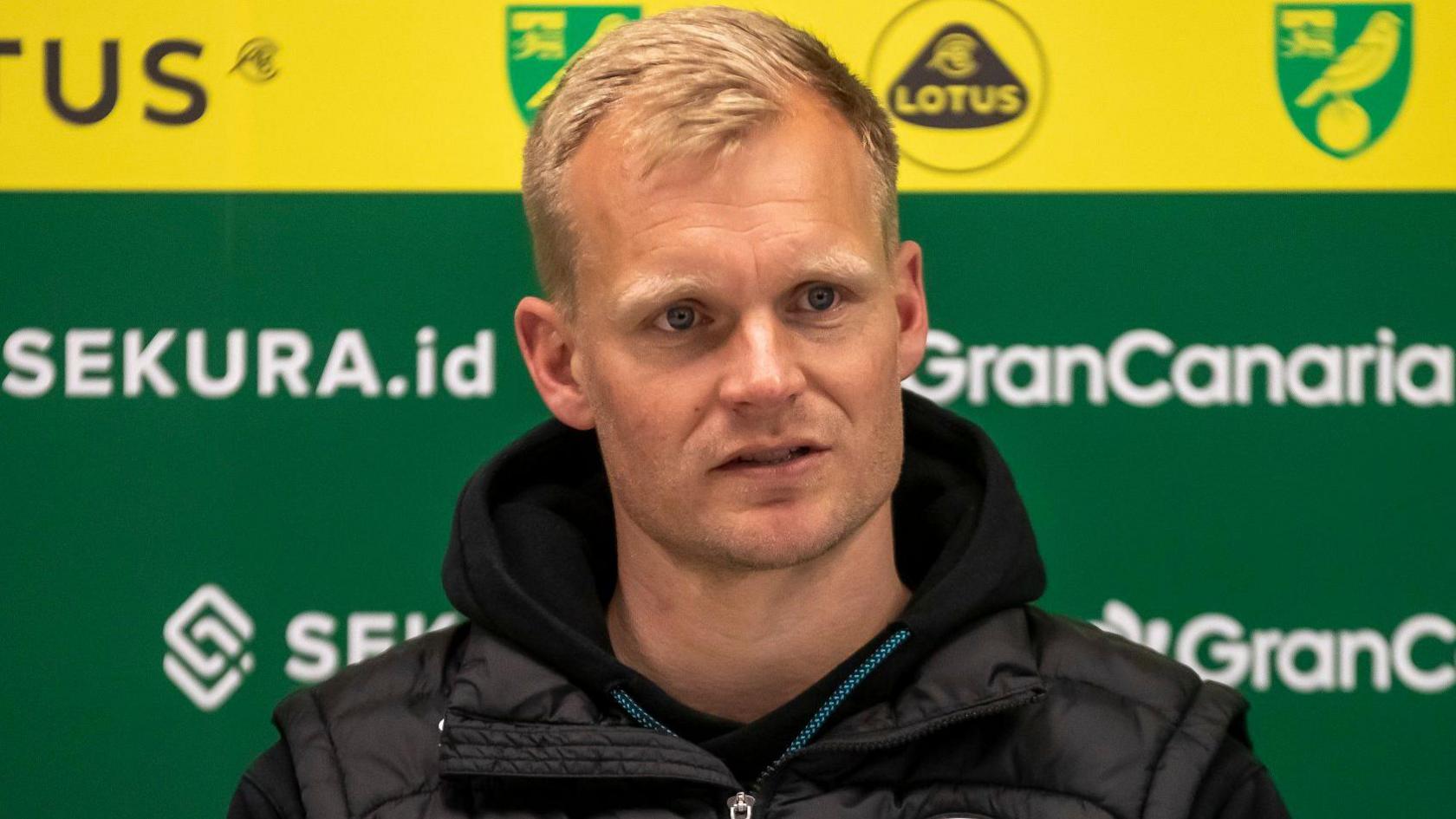 Liam Manning in the Norwich City press room while Bristol City boss