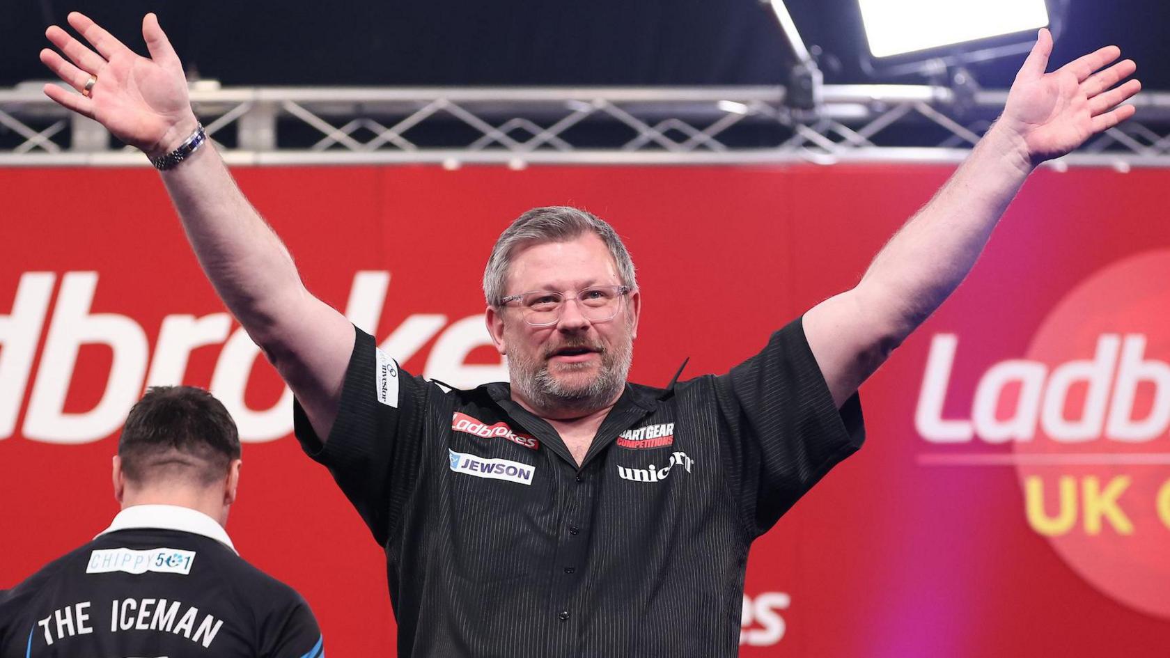 James Wade waves to the crowd