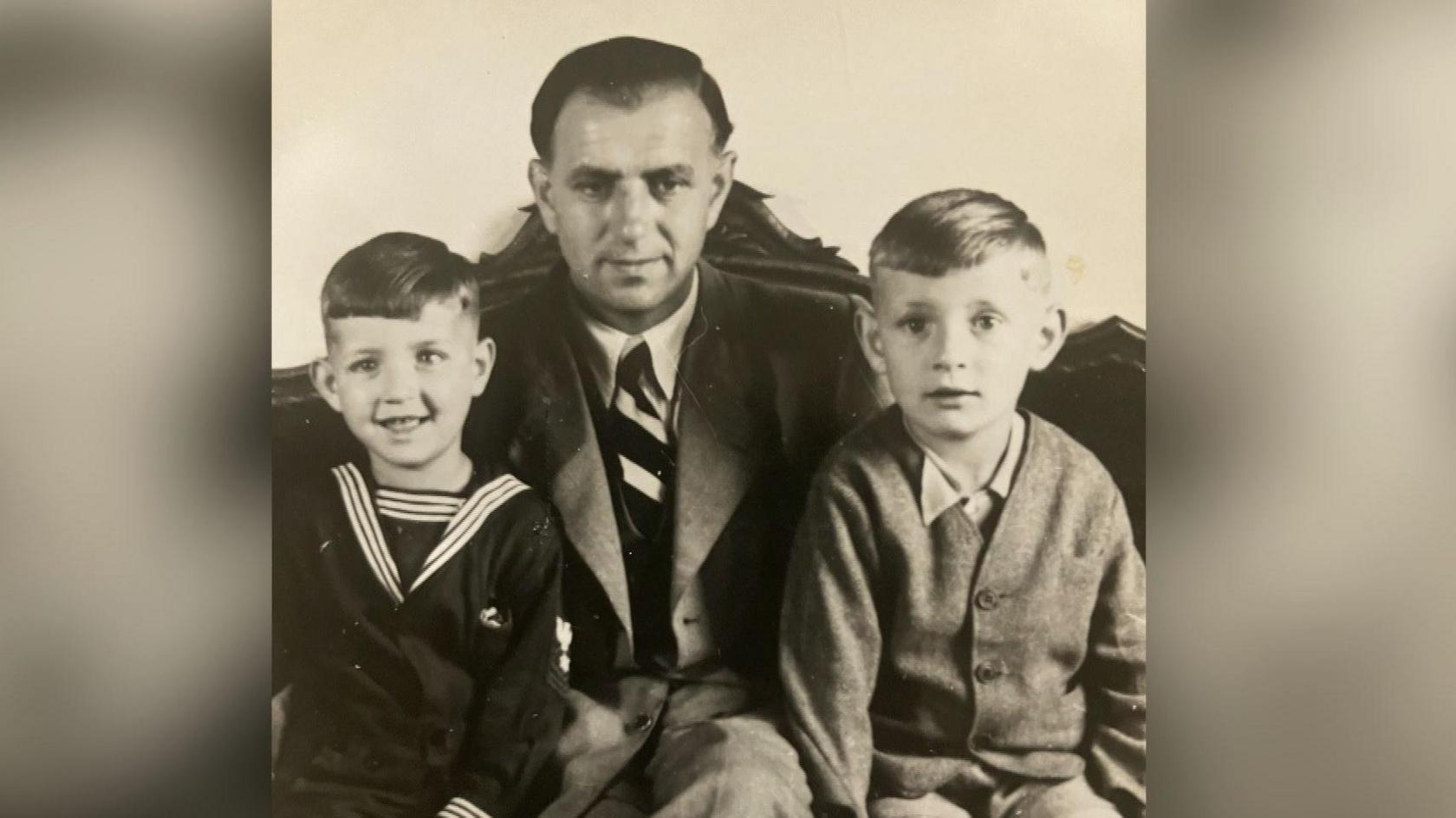 A photograph taken shortly after the war's end showing Peter Herke and his younger brother flanking their father.