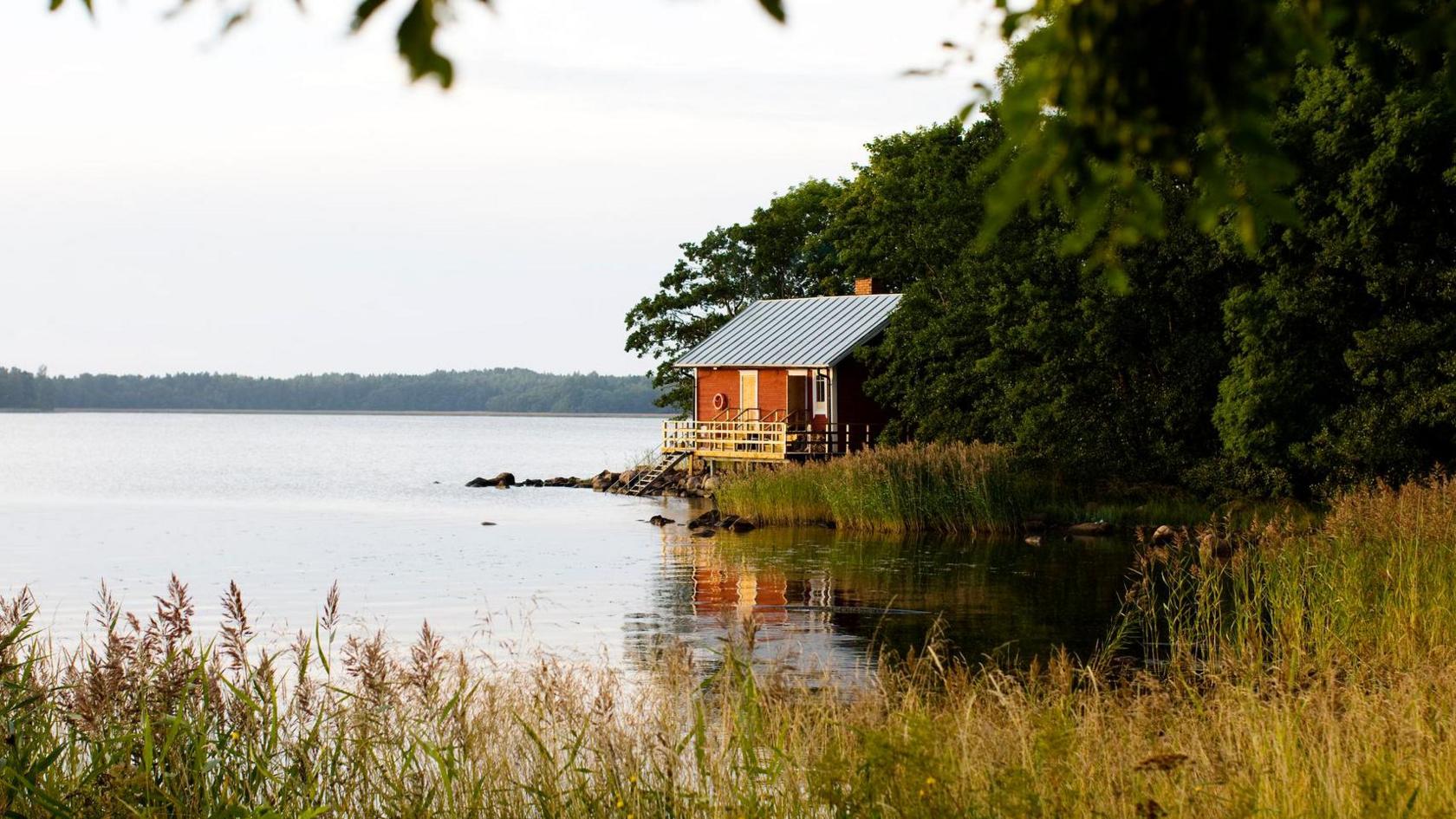A sauna hut next to a lake in Finland
