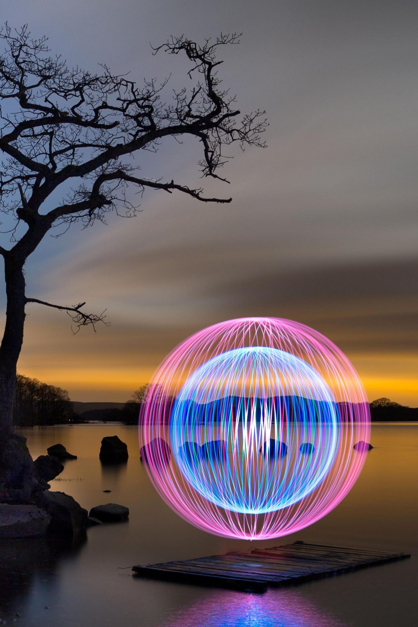 A purple/blue ball of light at night 