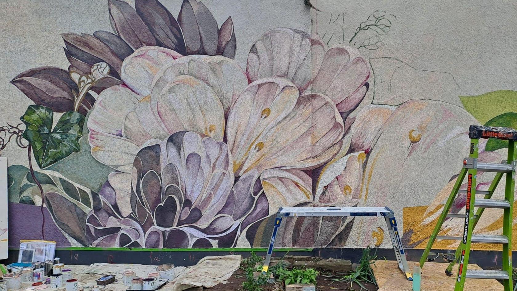 Mural depicting flowers on a wall