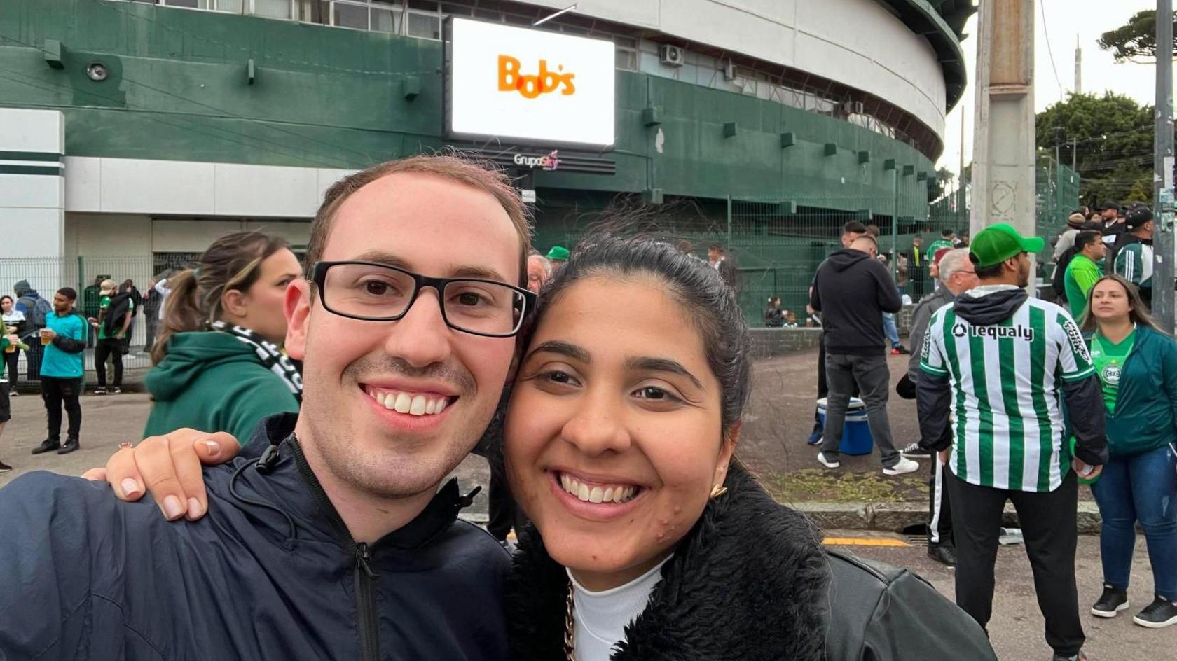 Jonny and Ana Clara Butcher outside Coritiba's stadium