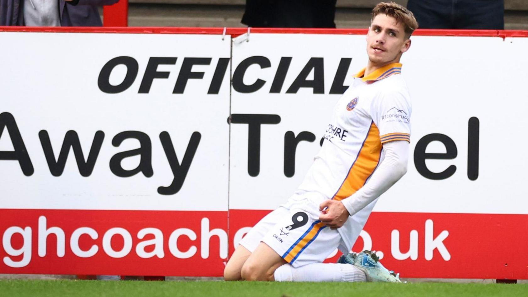 George Lloyd celebrates after scoring for Shrewsbury