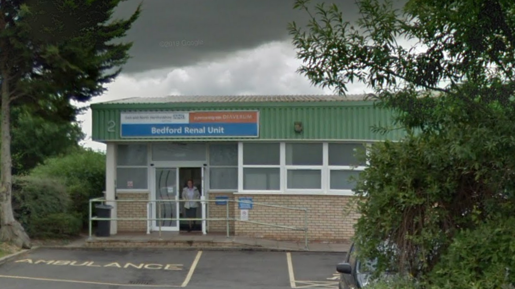 Bedford Renal Unit, a single storey light brick building with green metal cladding, where dialysis patients go for treatment on Napier Road