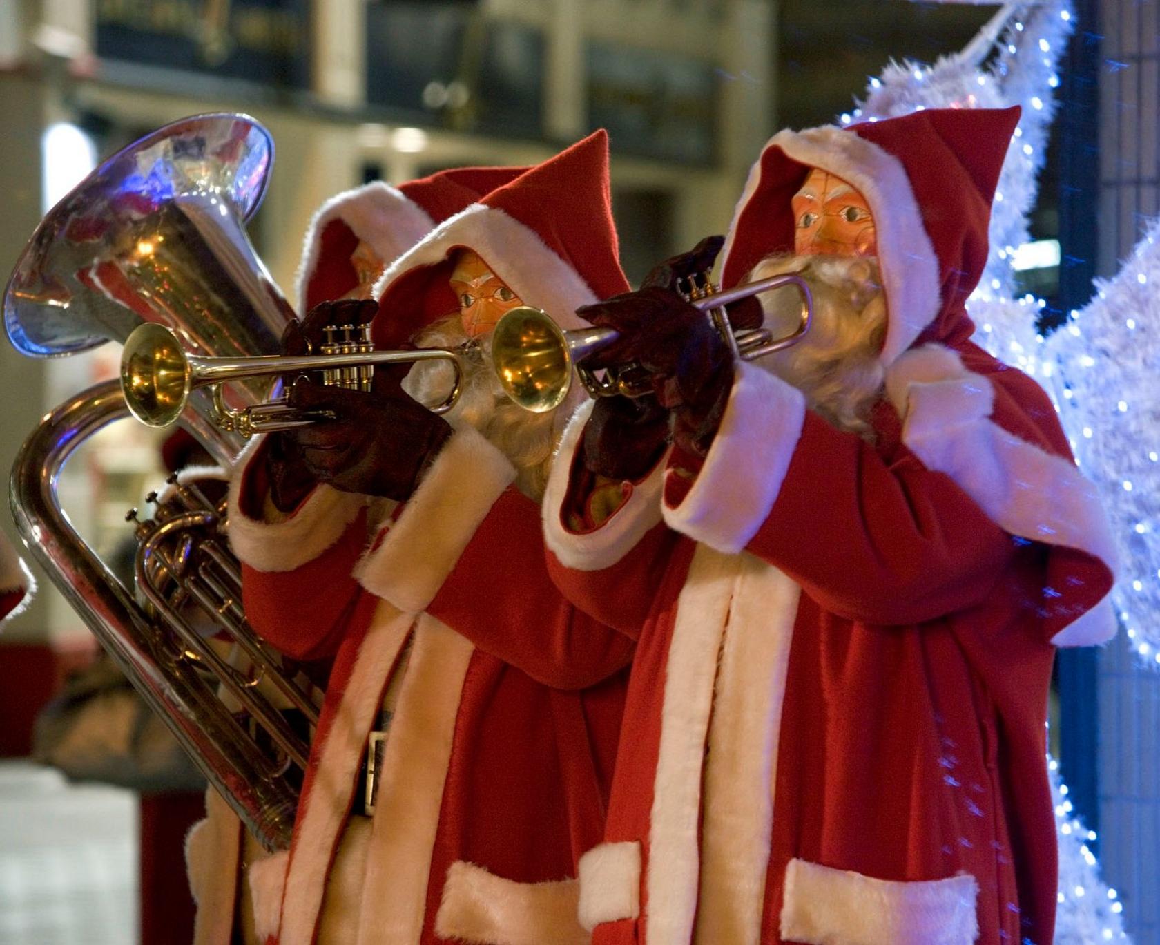 Robot Santas playing musical instruments