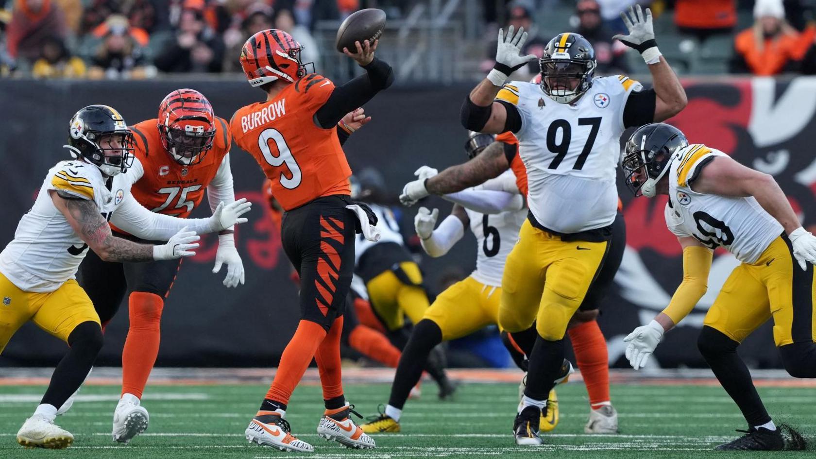 Pittsburgh Steelers' Cam Heyward attempts to stop a pass from Cincinnati Bengals' Joe Burrow in the NFL game in December