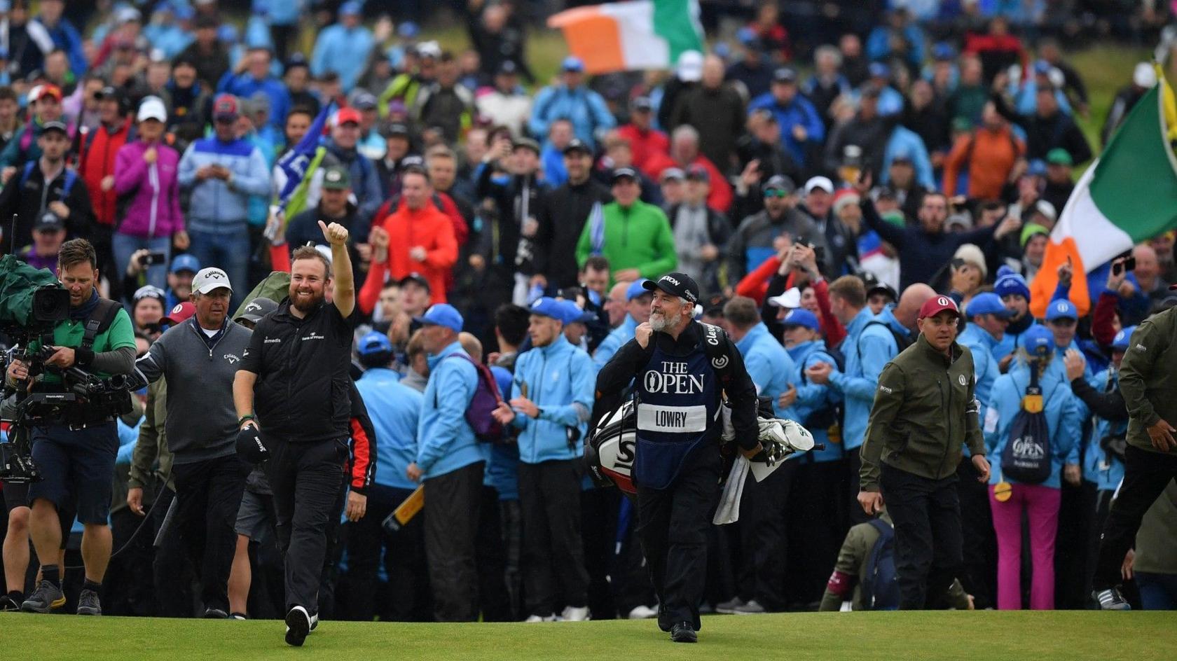 Shane Lowry acknowledges the fans as he walks down the 18th fairway at Royal Portrush during the 2019 Open Championship