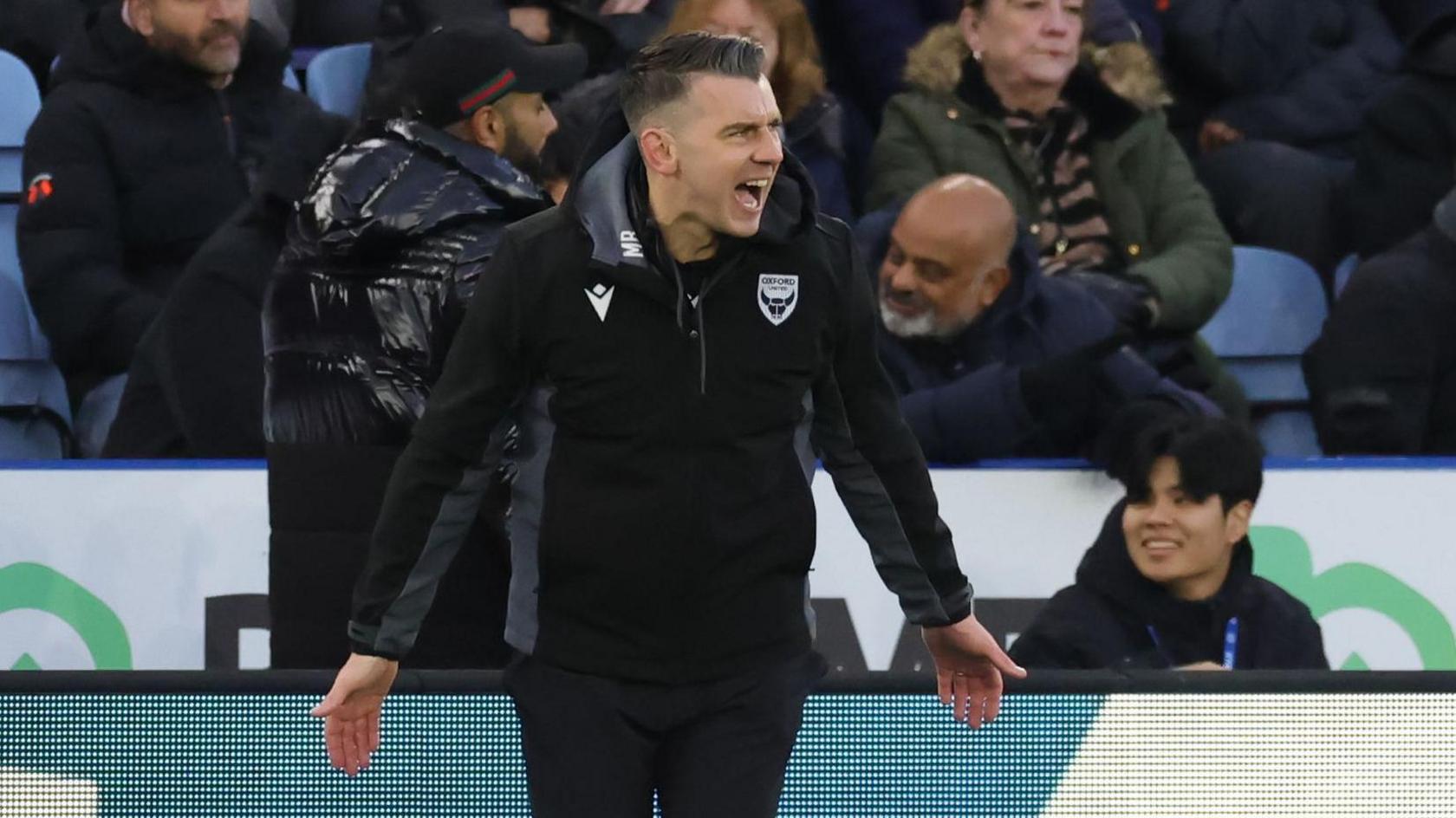 Oxford boss Matt Bloomfield smiling as his side win at Leicester