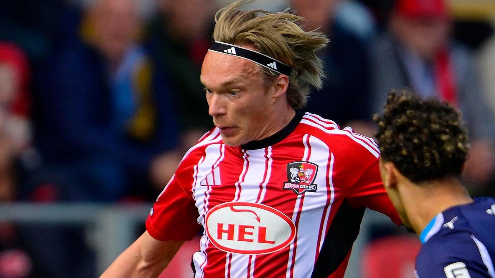 Winger Ilmari Niskanen in action for Exeter City.