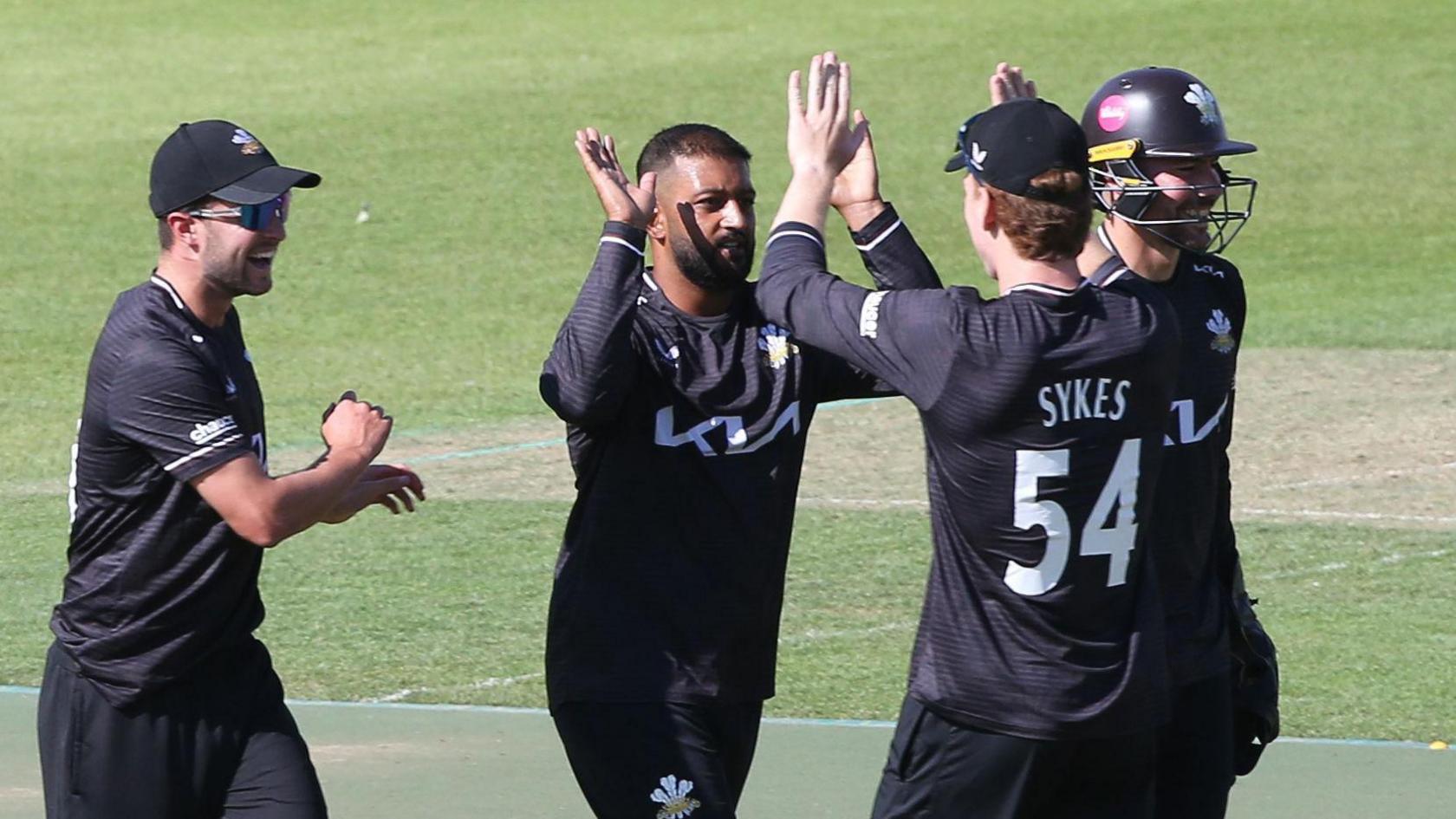 Surrey players celebrate taking a wicket against Kent in the One-Day Cup
