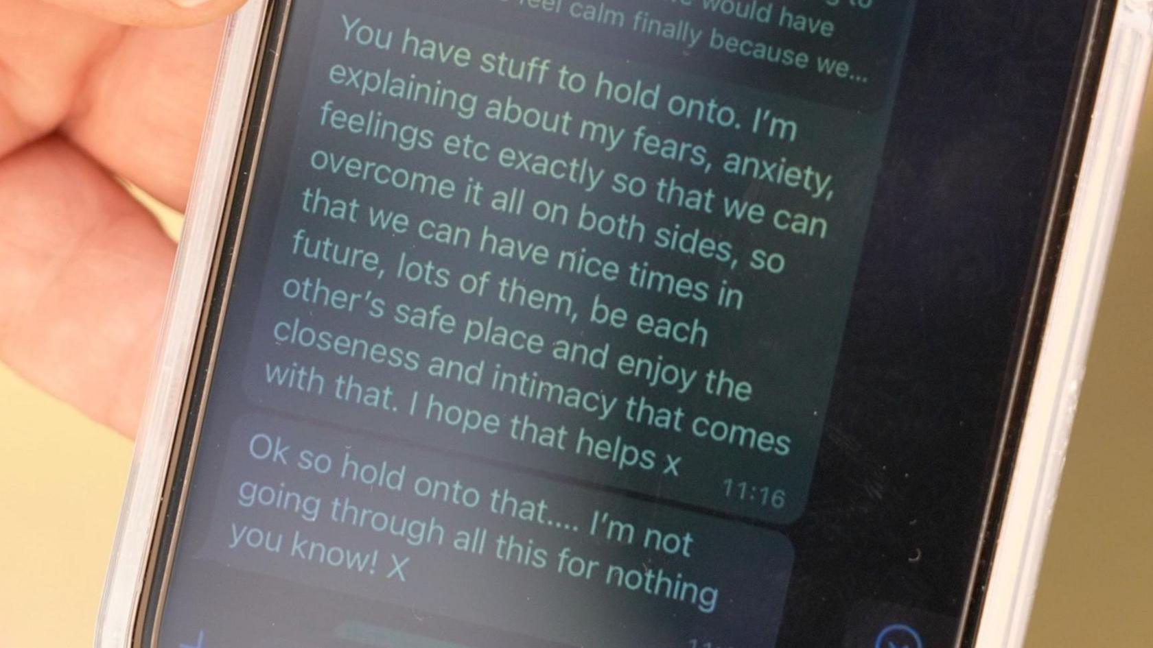 Image shows a phone with a text message on it that reads: 'You have stuff to hold onto. I'm explaining about my fears, anxiety, feelings etc exactly so that we cna overcome it all on both sides, so that we can have nice times in the future, lots of them, be each other's safe place and enjoy the intimacy that comes with that. I hope that helps x