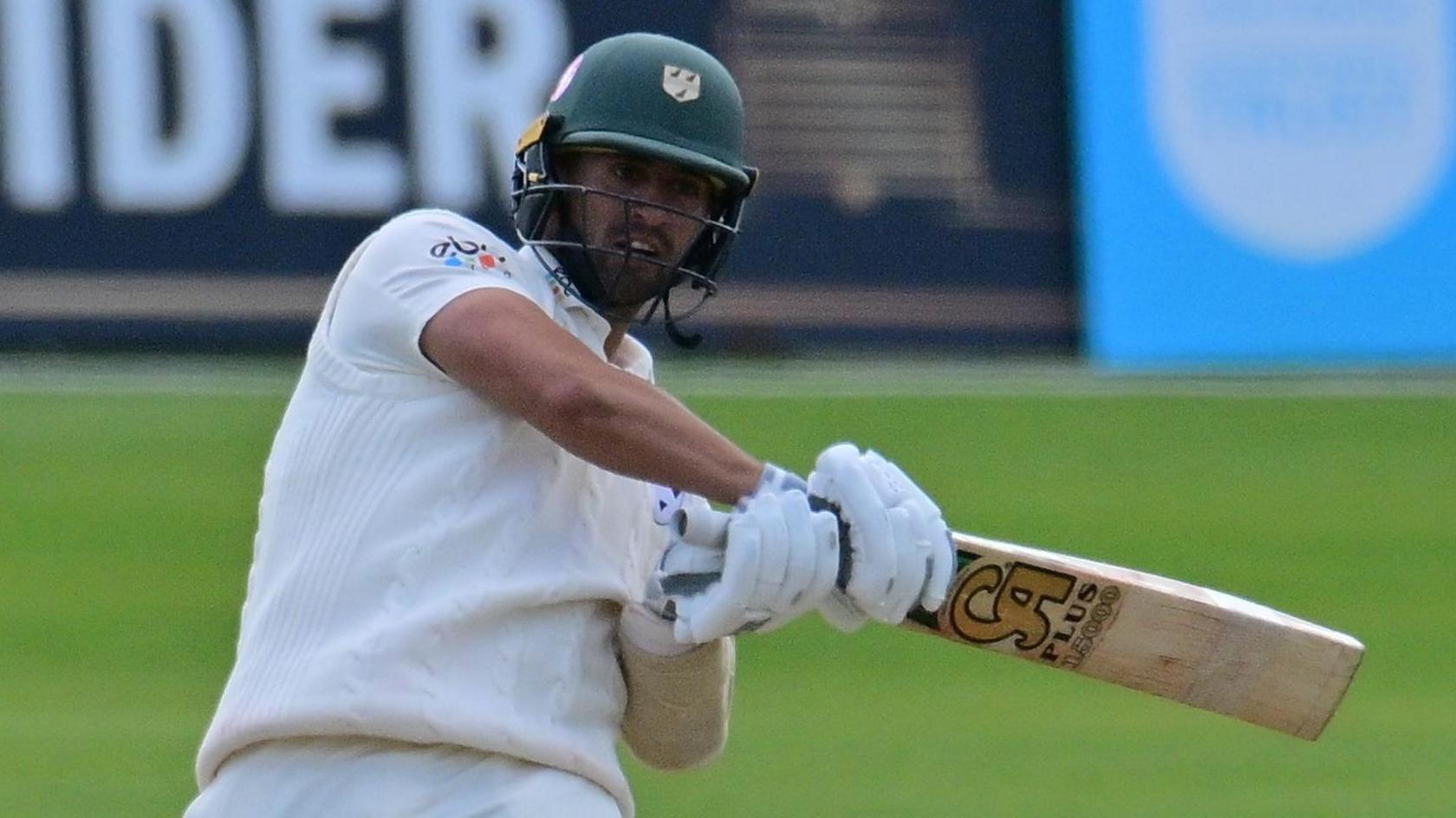 Brett D'Oliveira swings a cricket bat while playing for Worcestershire