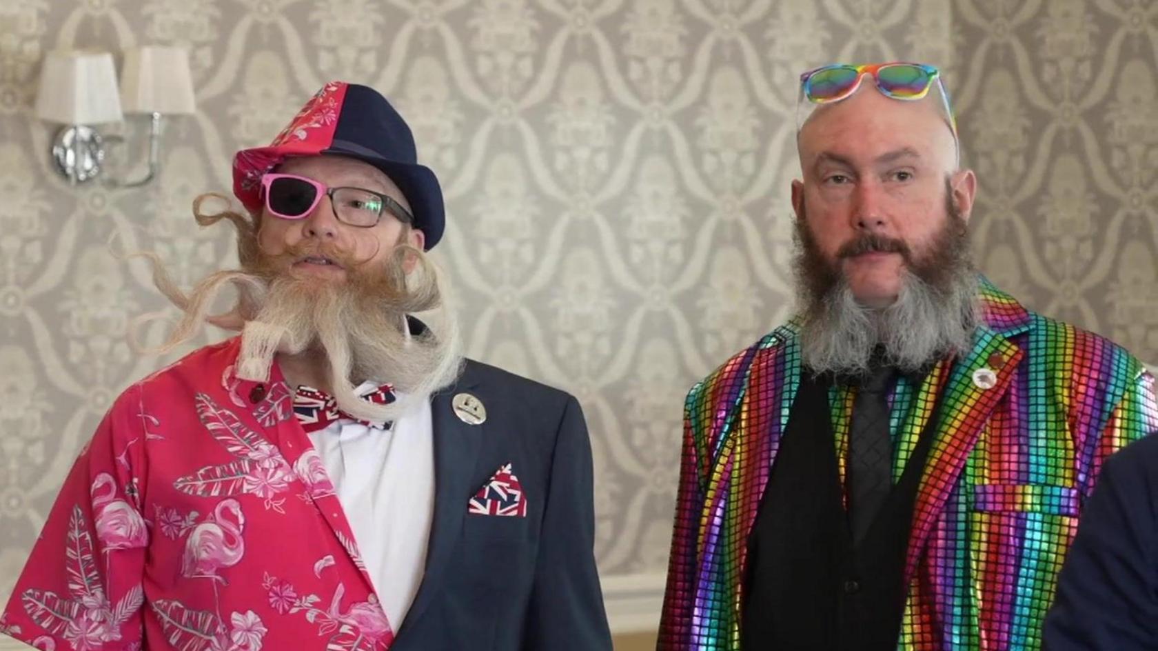 Two of the participants each with an extravagant beard