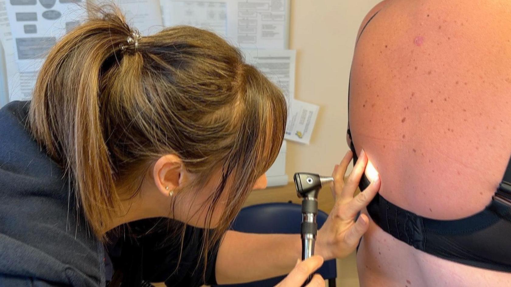 A nurse doing an examination