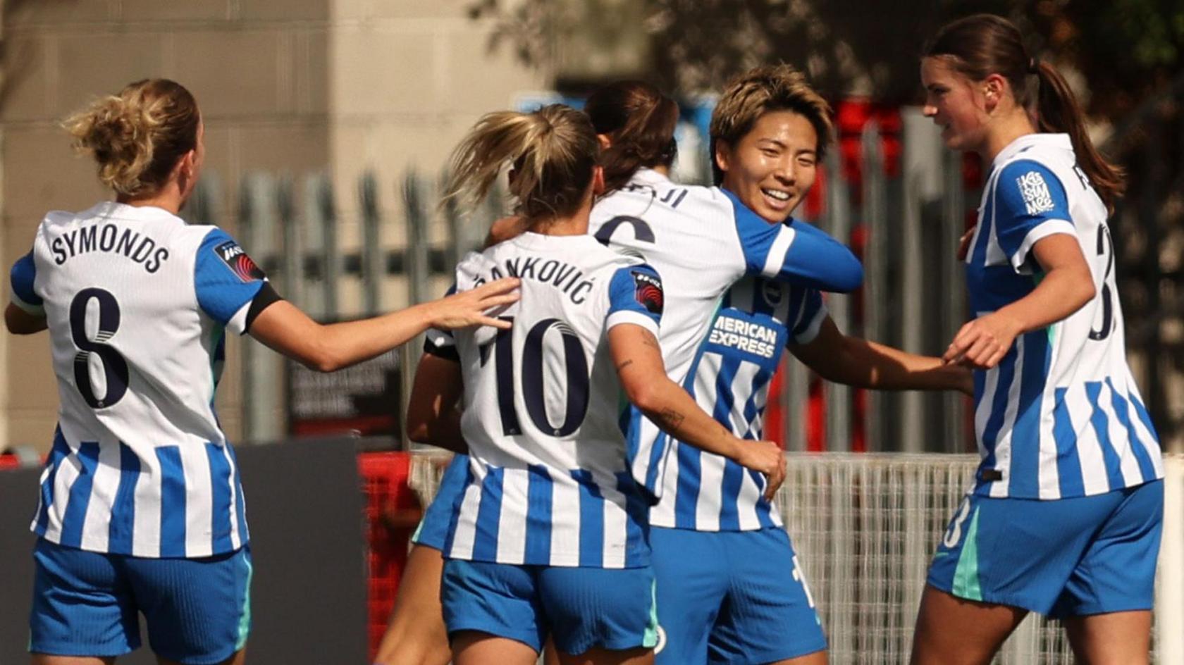 Brighton players celebrate Kiko Seike's goal against West Ham in the WSL