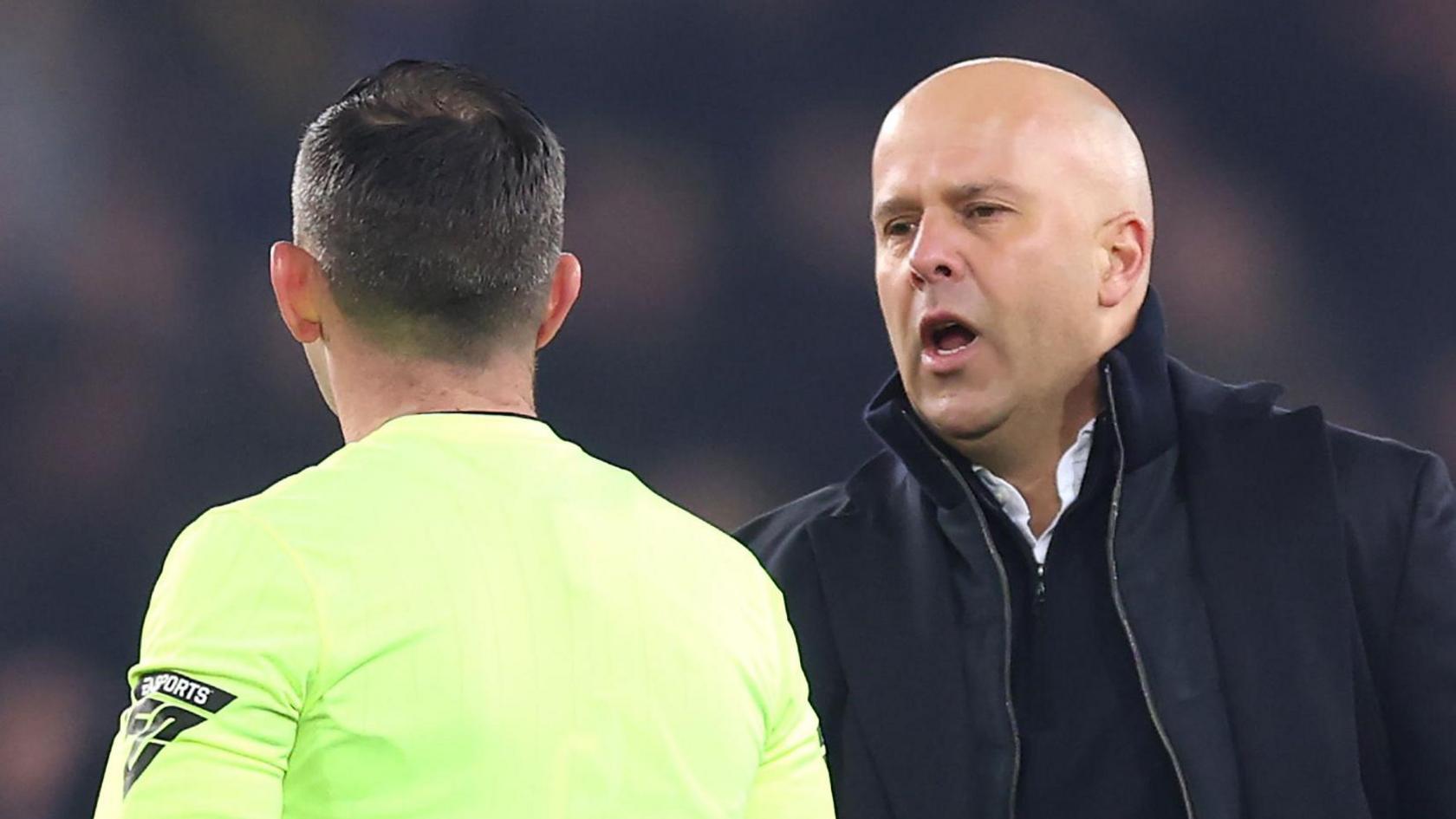 Liverpool manager Arne Slot speaks to referee Michael Oliver after the 2-2 Premier League draw at Everton